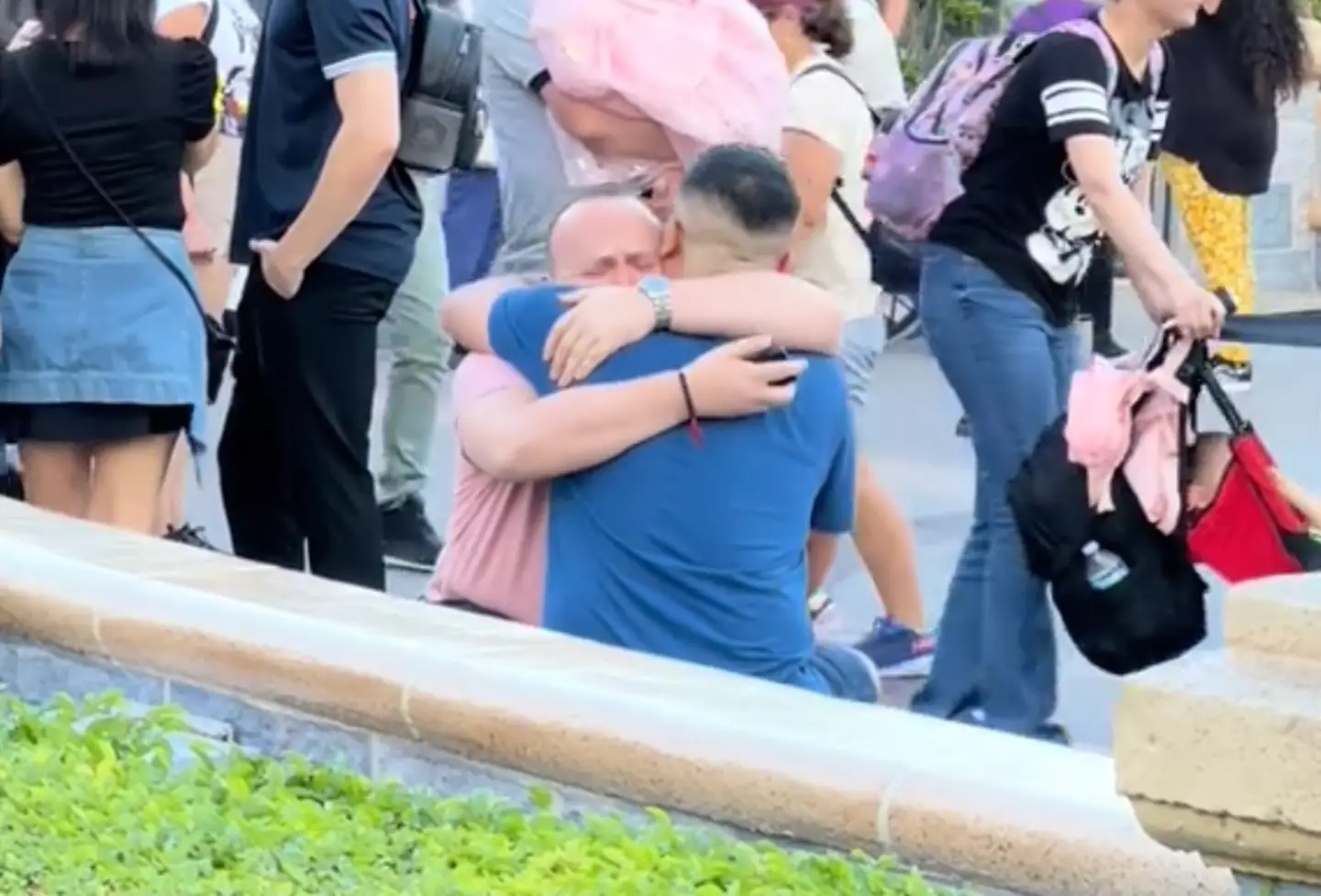 The pair embrace after getting engaged.