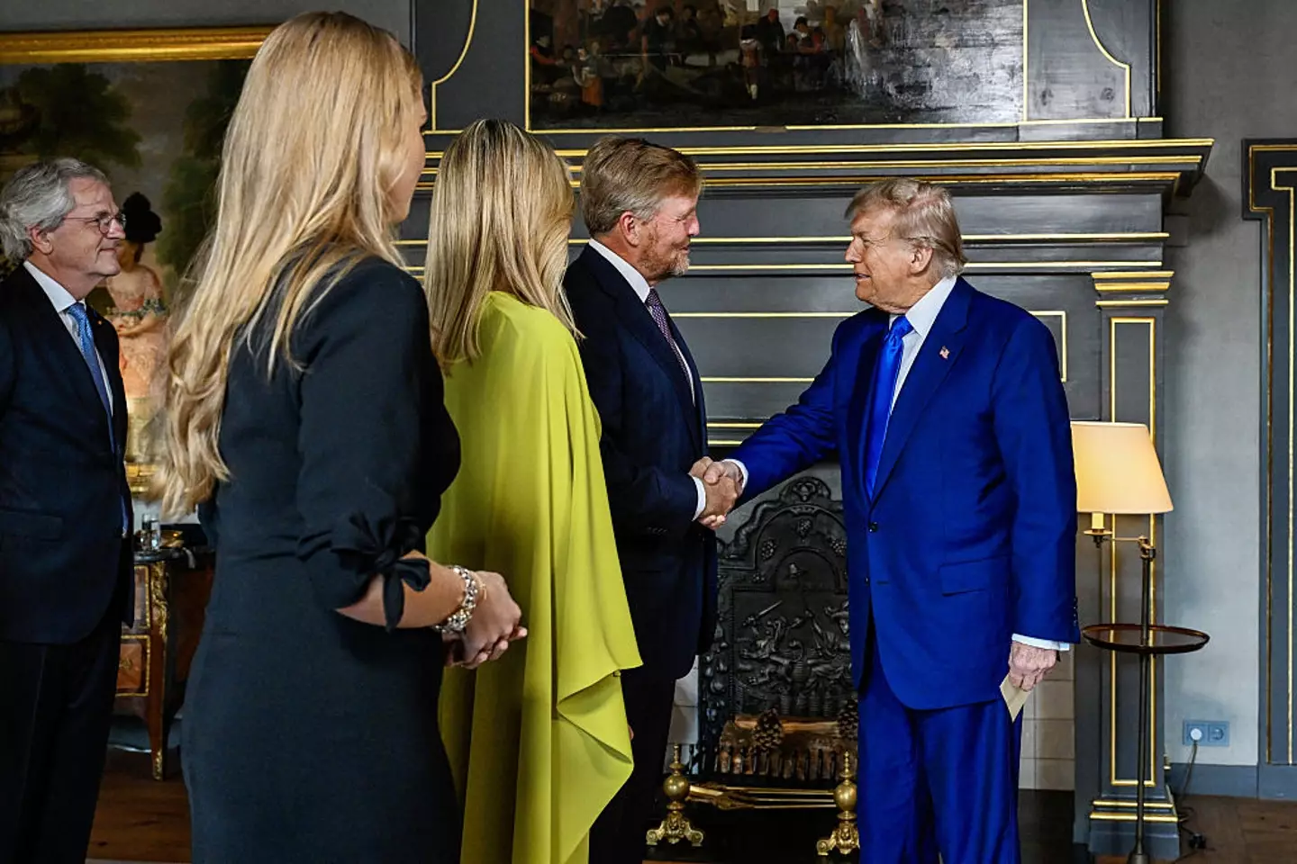 The body language expert explained Trump was happy to meet King Willem-Alexander (MISCHA SCHOEMAKER/POOL/AFP via Getty Images)