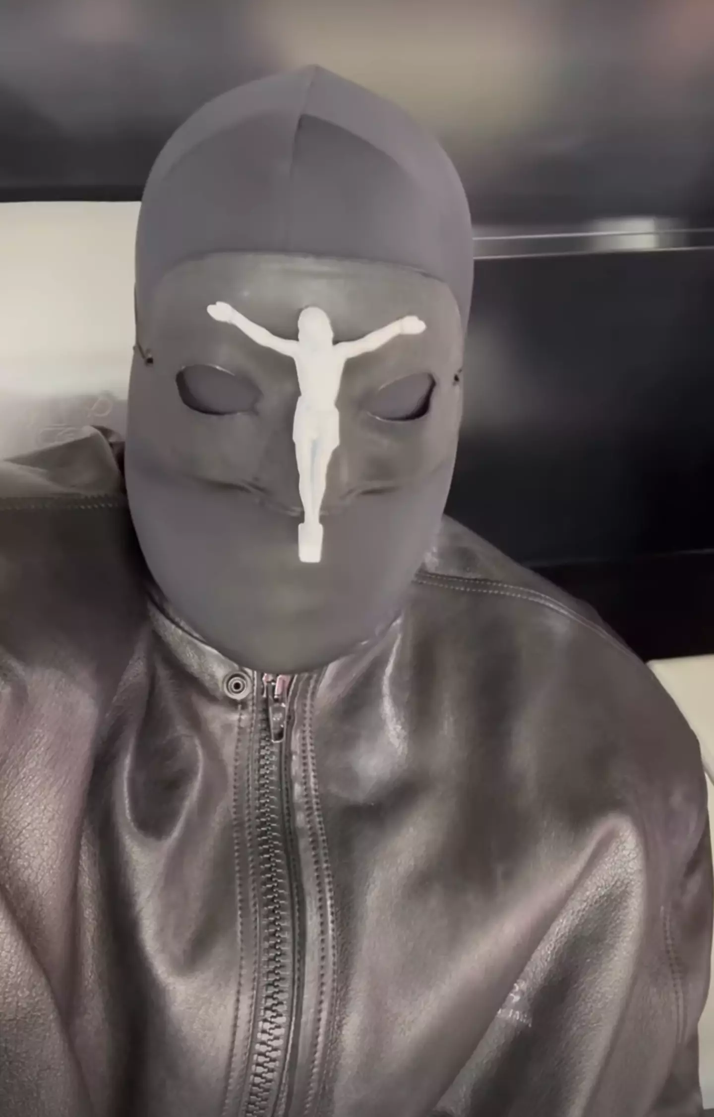 The rapper wore a full mask to attend the Super Bowl on Sunday.