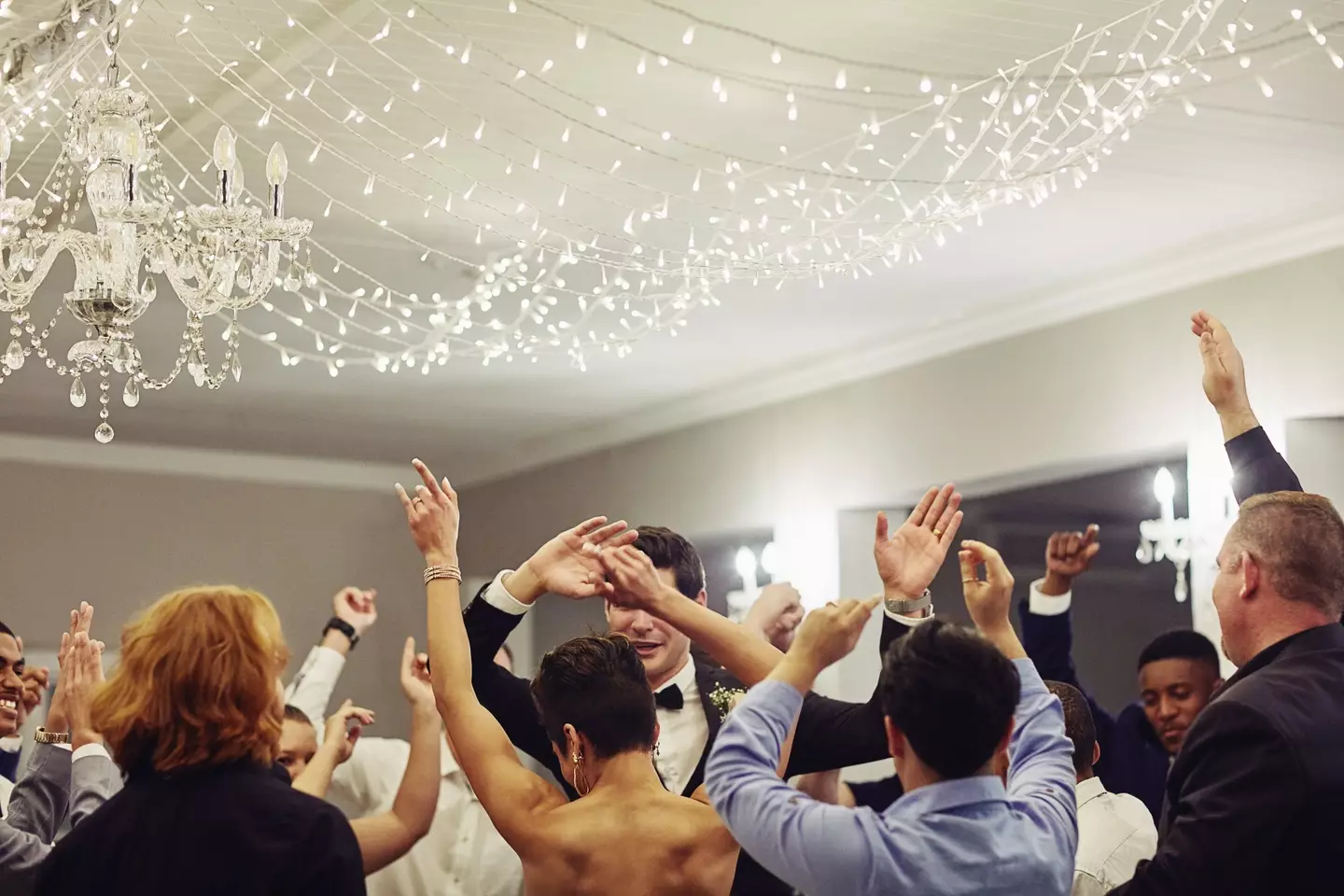 What song gets you onto the dance floor at a wedding? (Getty Stock Images/ LumiNola)
