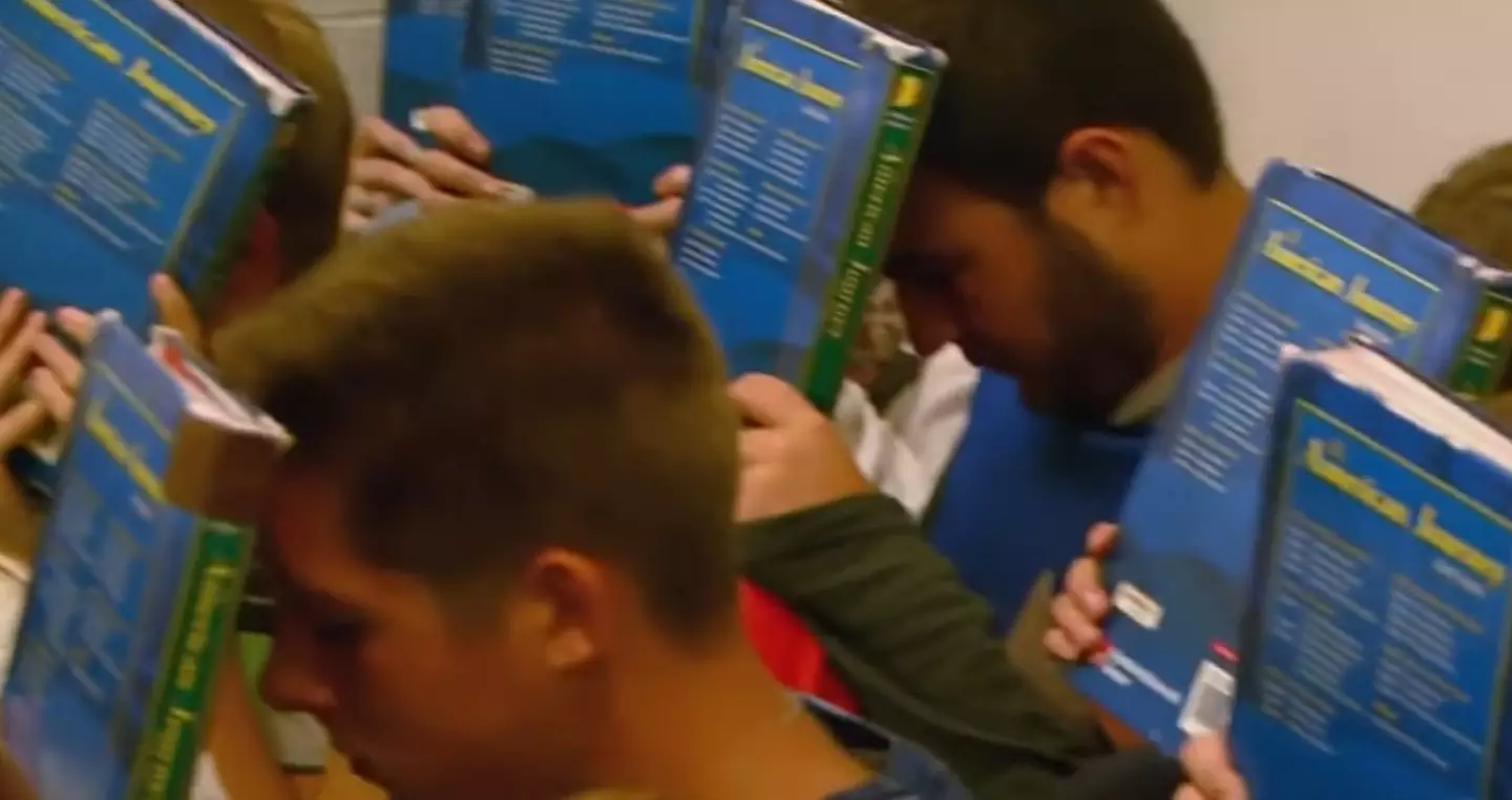 Part of school shooter drills involve students hiding in the corner with books over their faces.