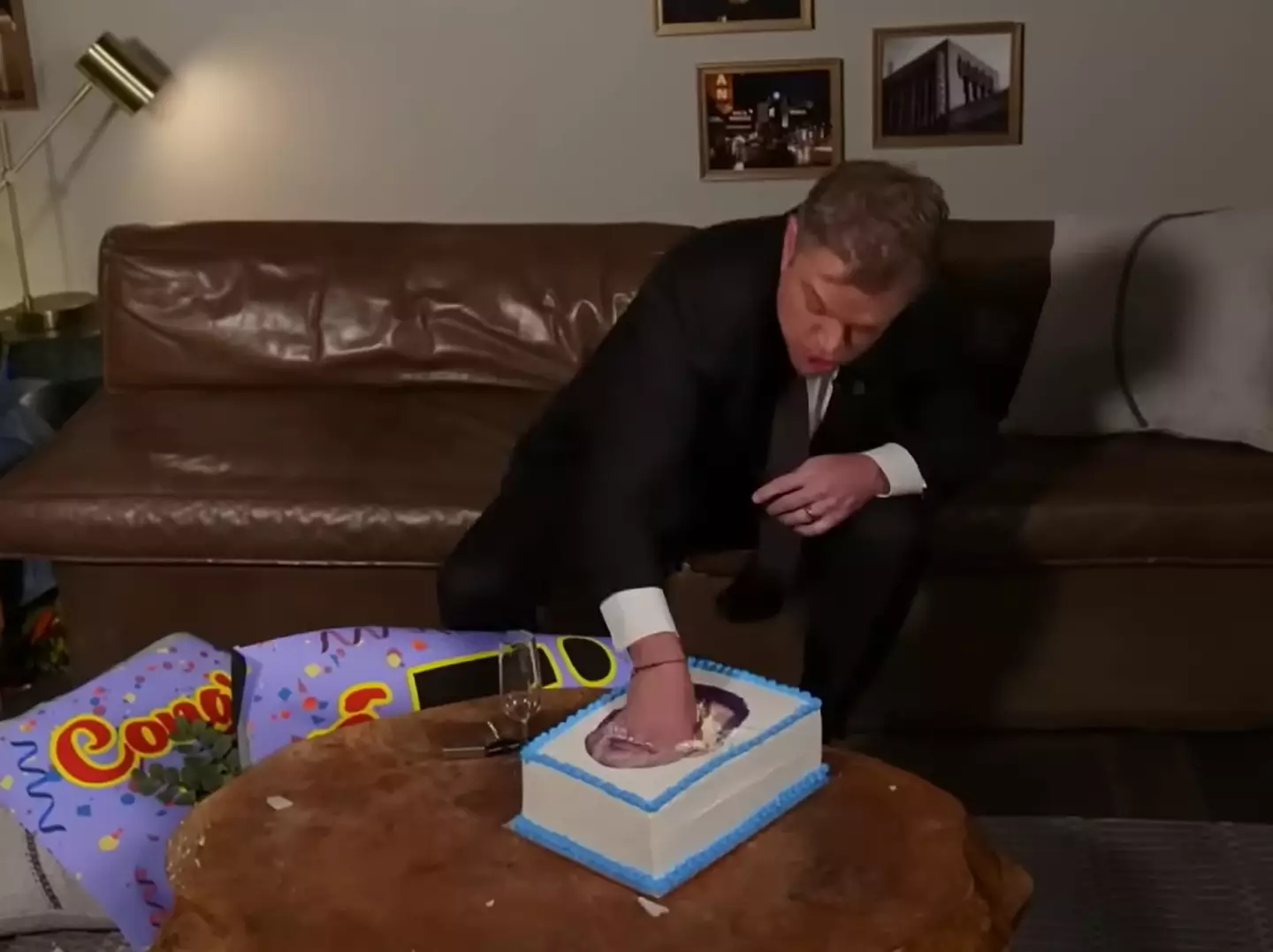 Damon destroyed a cake with Kimmel's face on it.