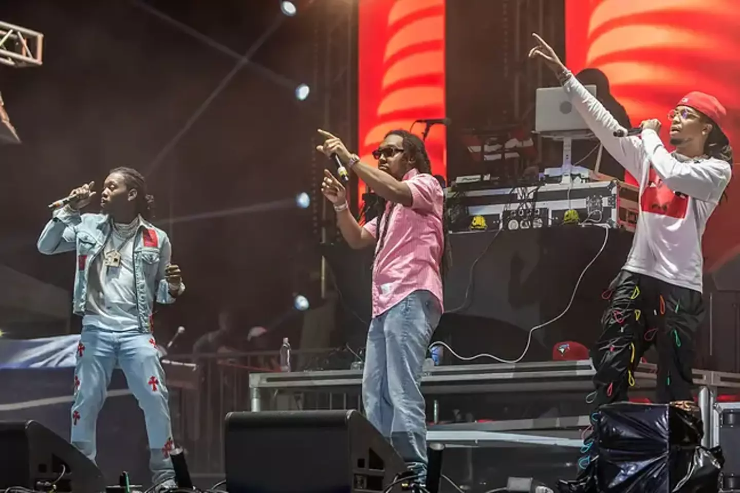 Takeoff (centre) performed alongside his family members as part of group Migos.