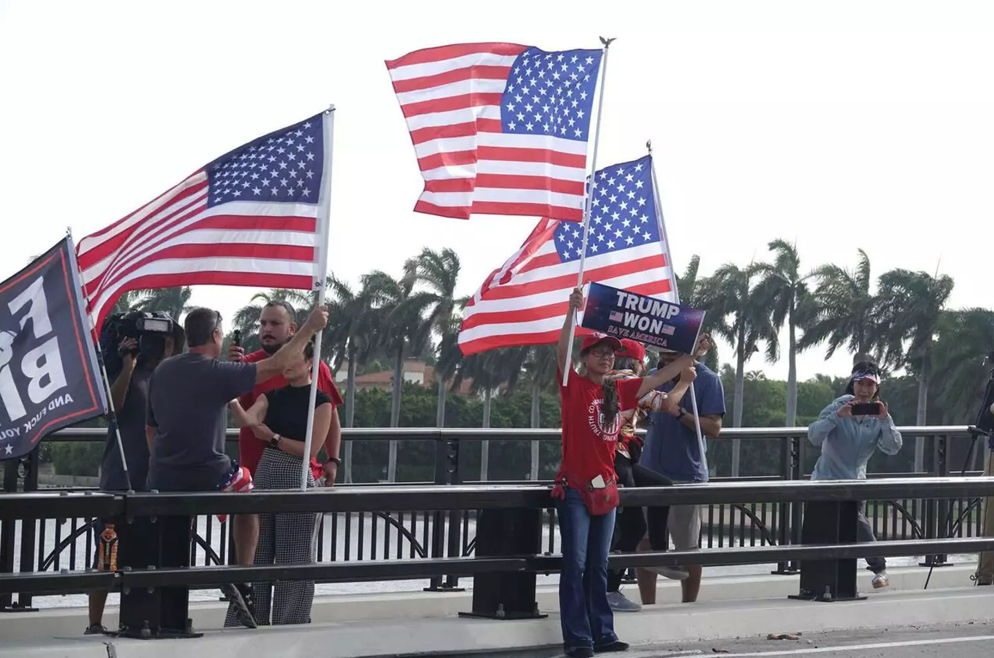 rotesters gather near Donald Trump's Mar-a-Lago estate.