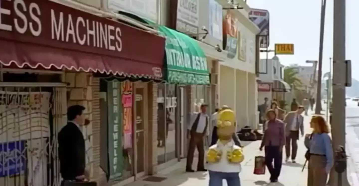 Homer can be seen walking around the street looking terrified (Disney)