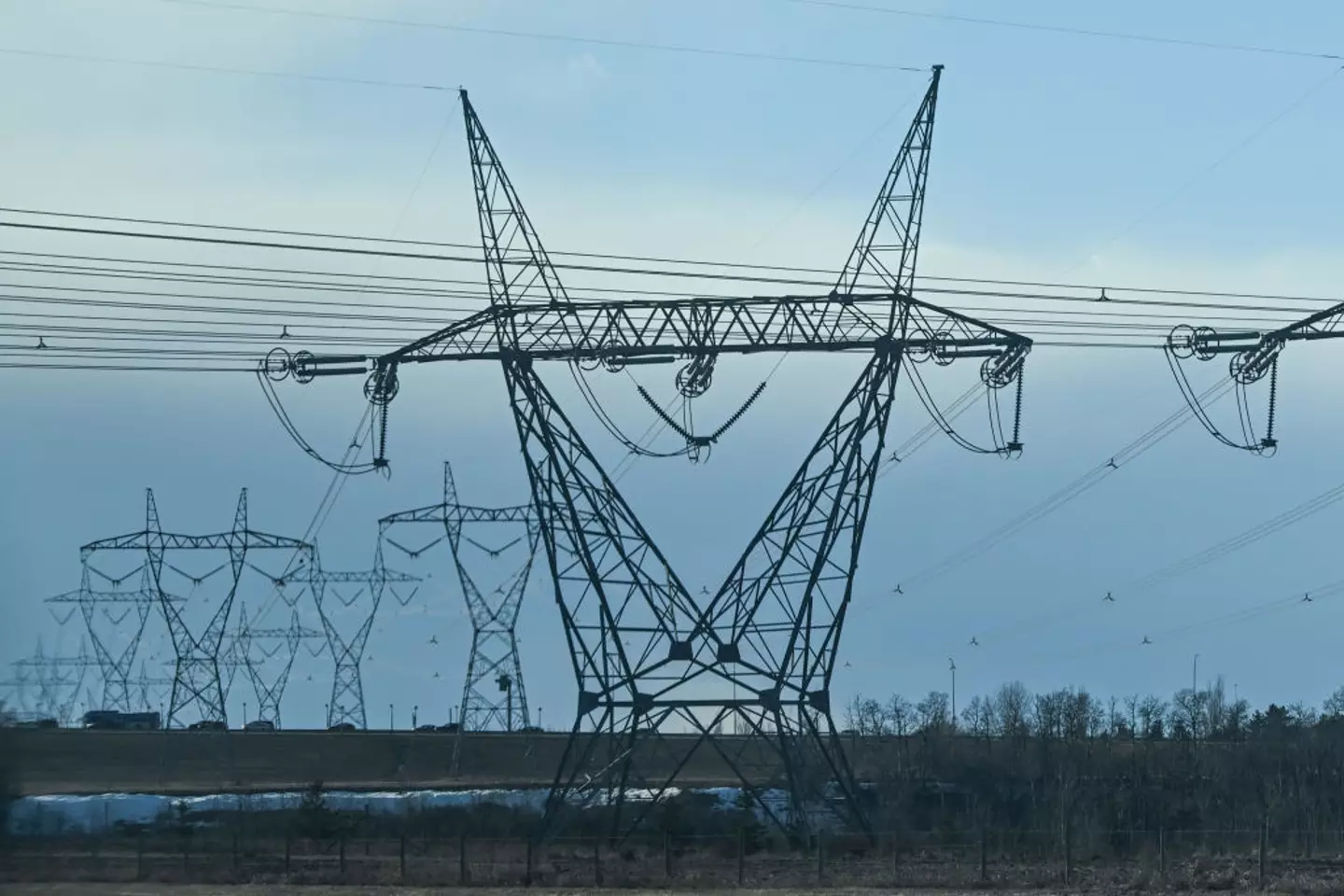 A view of electric poles and wires stretching along Edmonton's Anthony Henday Drive in Edmonton, Alberta, Canada (Artur Widak/NurPhoto via Getty Images)