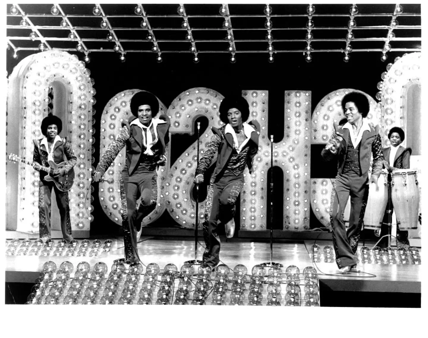 Tito Jackson playing guitar alongside The Jacksons - including Michael in the middle (Michael Ochs Archives/Getty Images)