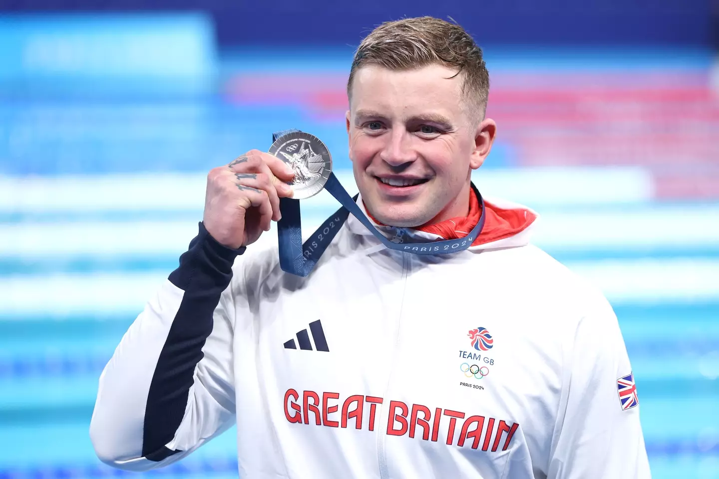 Adam Peaty holding his silver medal after the Men’s 100m Breaststroke Final(Maddie Meyer/Getty Images)