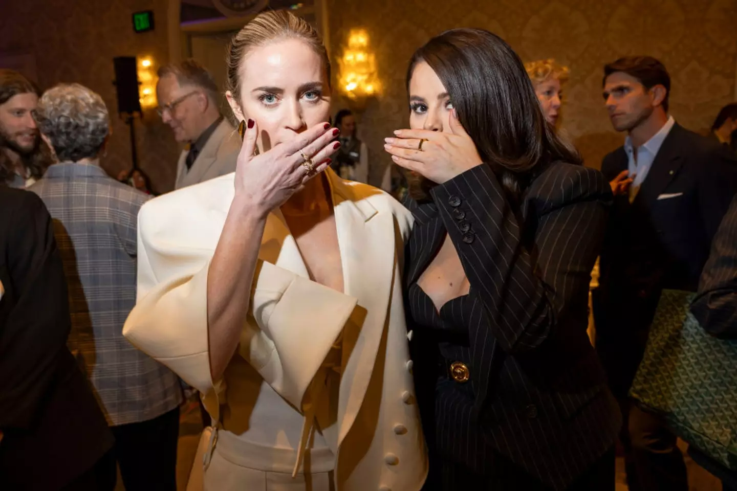 Why did Selena Gomez and Emily Blunt cover their faces for this photo?