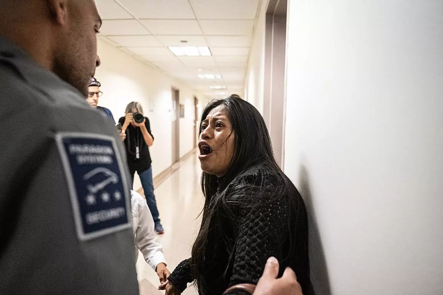 A woman became distressed after her husband was arrested by ICE (Stephanie Keith/Getty Images)