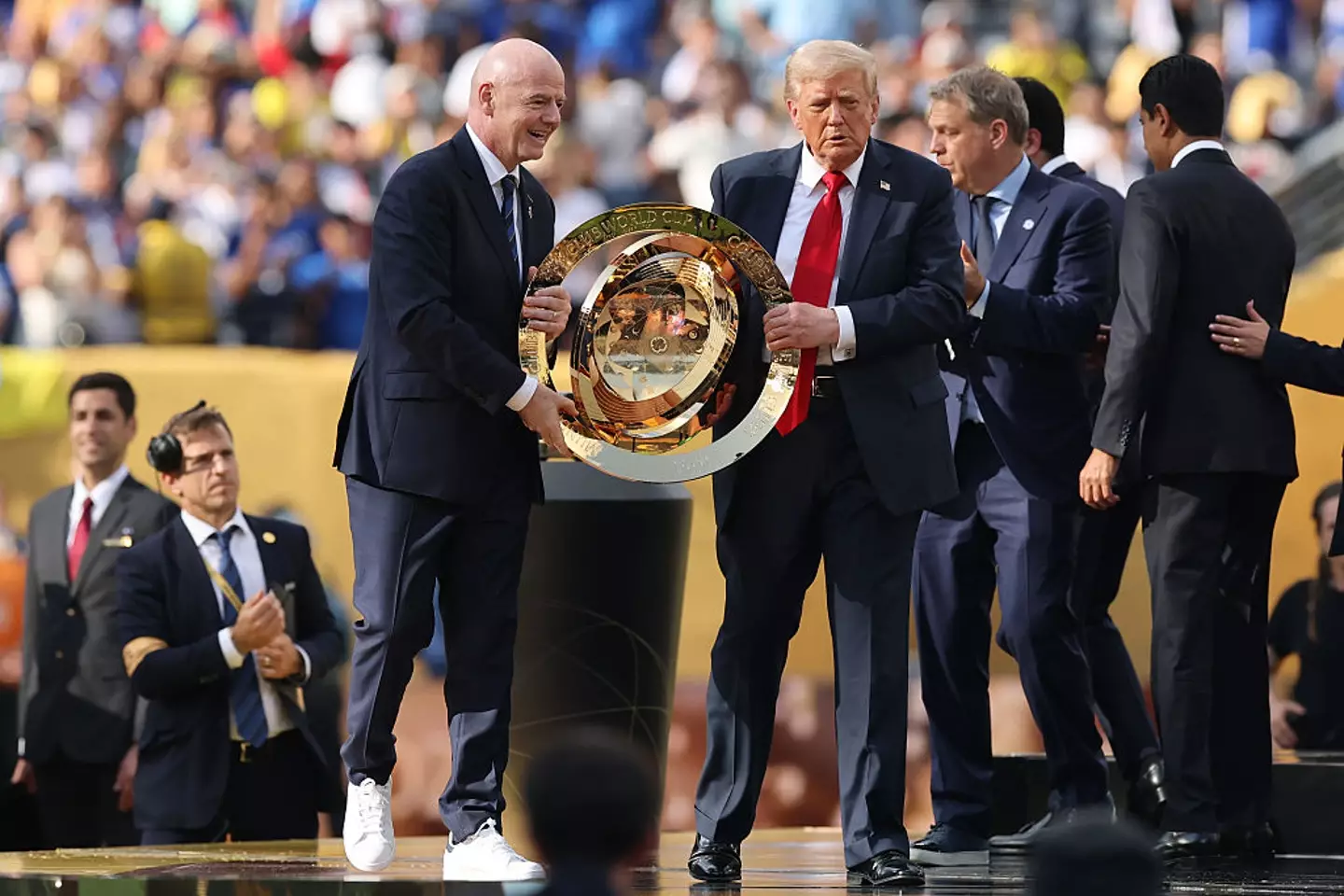 Trump handed the team a replica trophy (Alex Grimm/Getty Images)