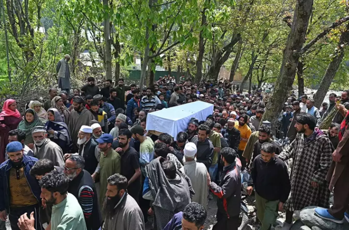 Locals carry the body of a Adil Hussain Shah, a pony rider who was among those killed in the attack (Waseem Andrabi/Hindustan Times via Getty Images)