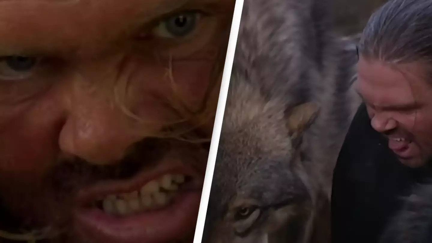 Man who lives with wolves starts eating dinner with them in crazy video