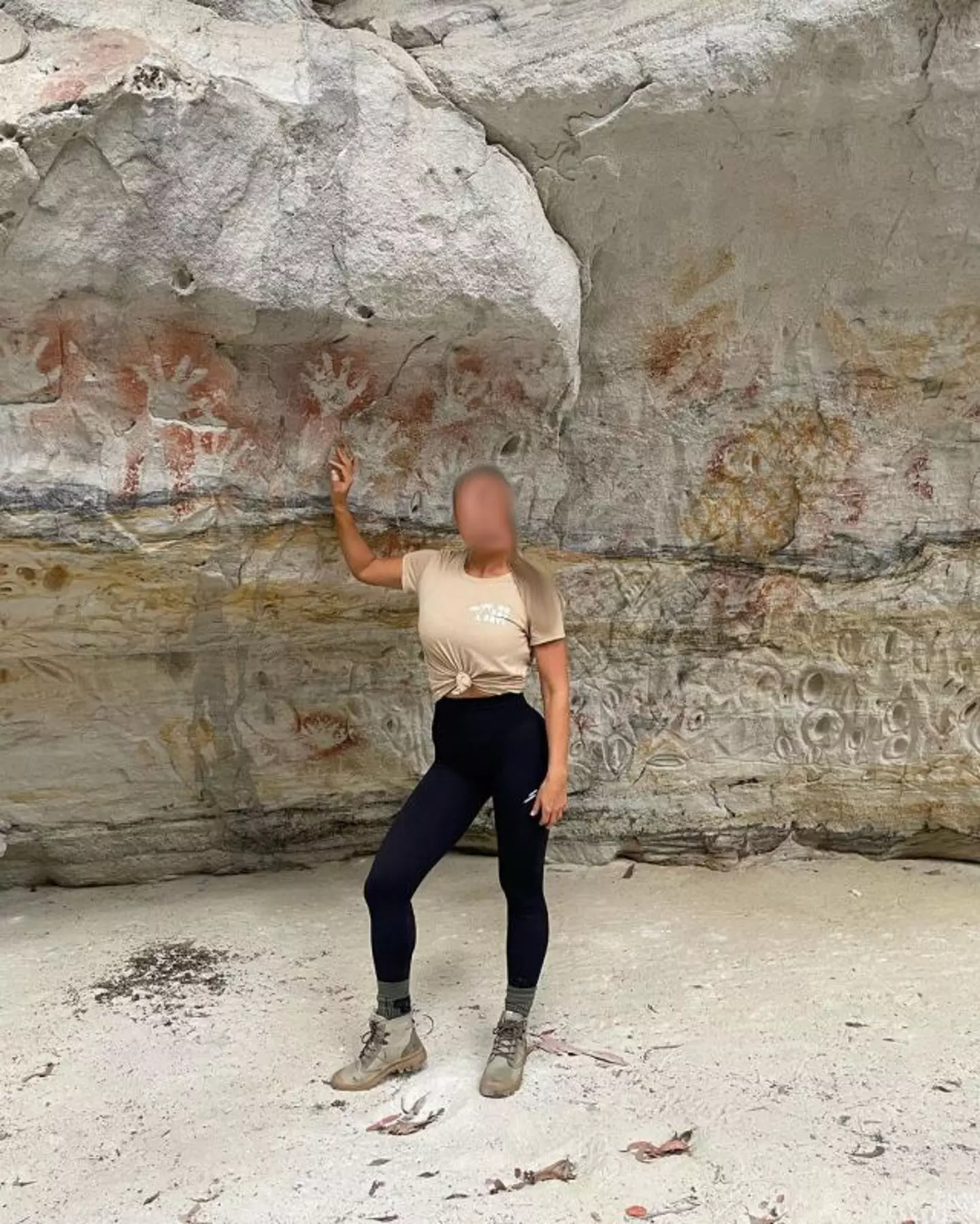 Australia park officials have slapped 'self-indulgent' influencers with hefty fines for committing 'disrespectful acts' around the rock art.