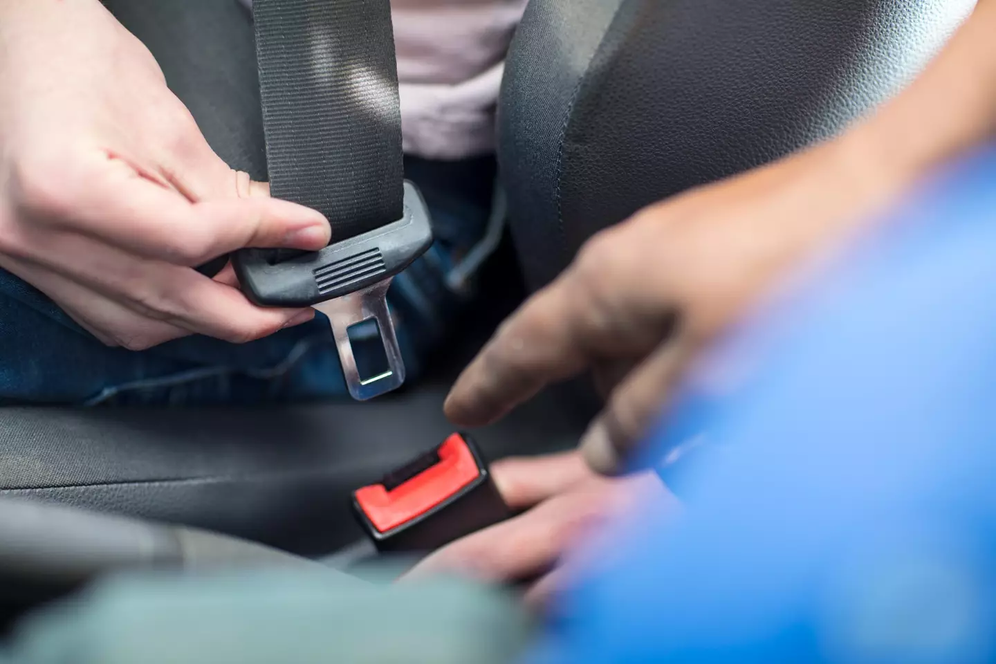 The buttons make the seatbelt easier to use (Westend61 / Getty)