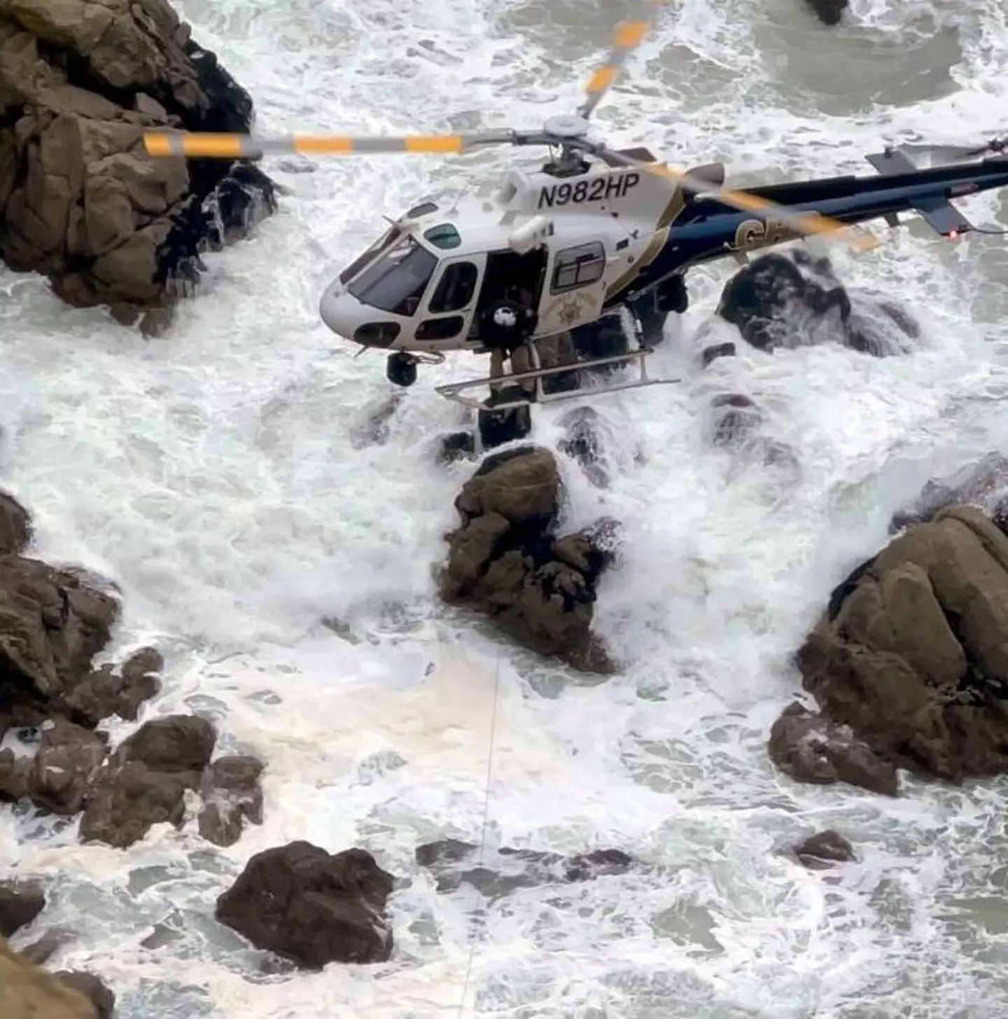 A helicopter lifted the adults to safety.