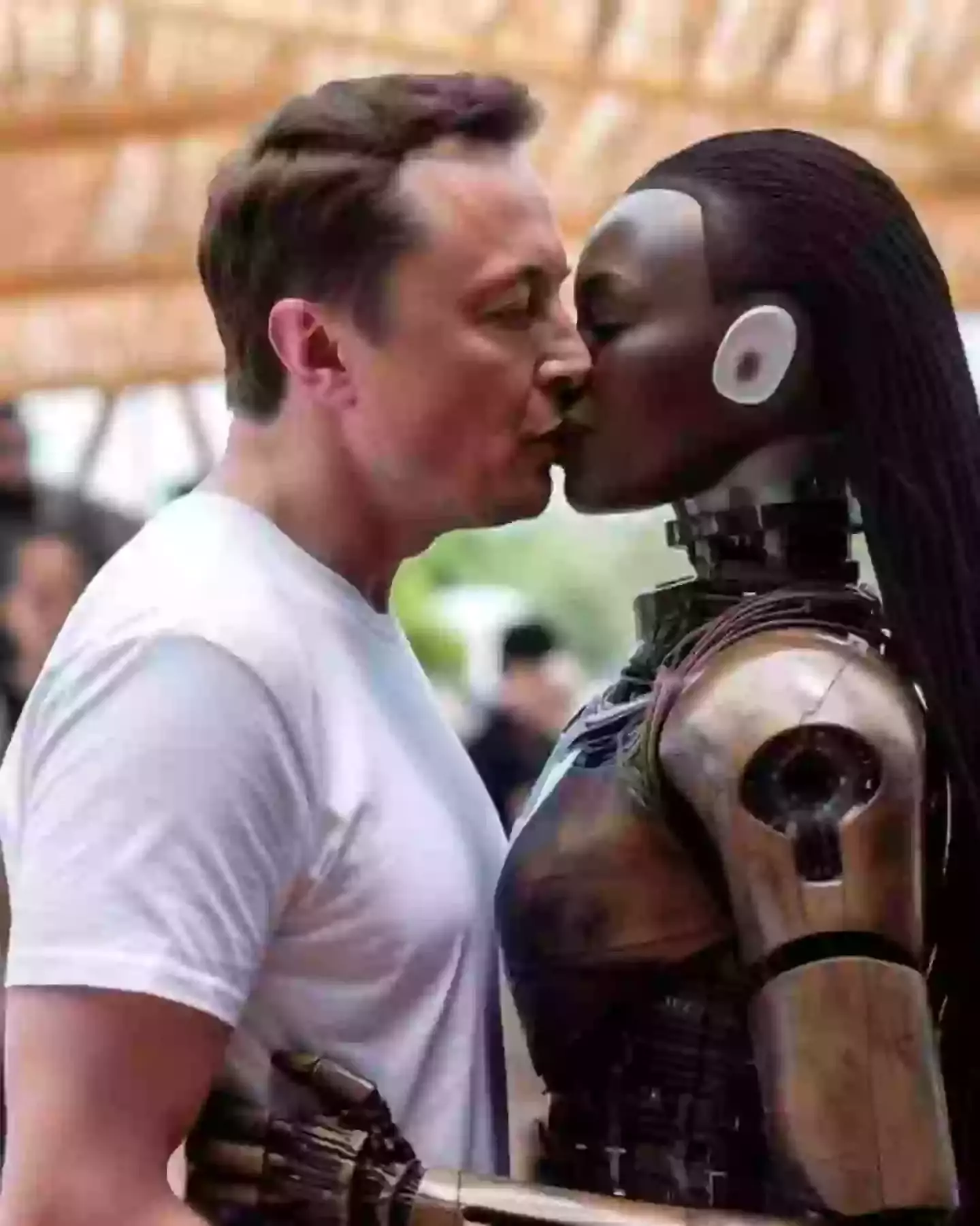 Musk apparently kissing one of the robots..(Pablo Guerrero/@art_is_2_inspire)
