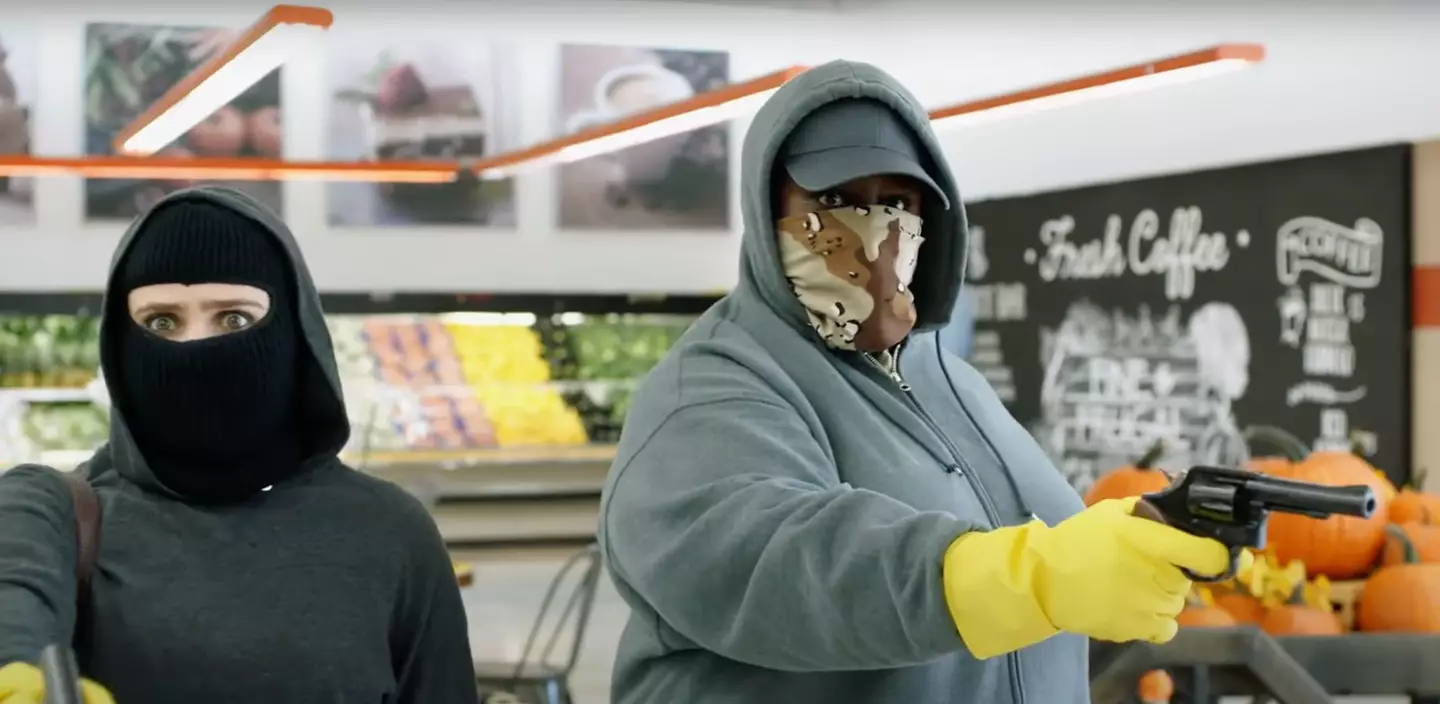 The moms hilariously rob a supermarket with washing up gloves on (NBCUniversal Media)