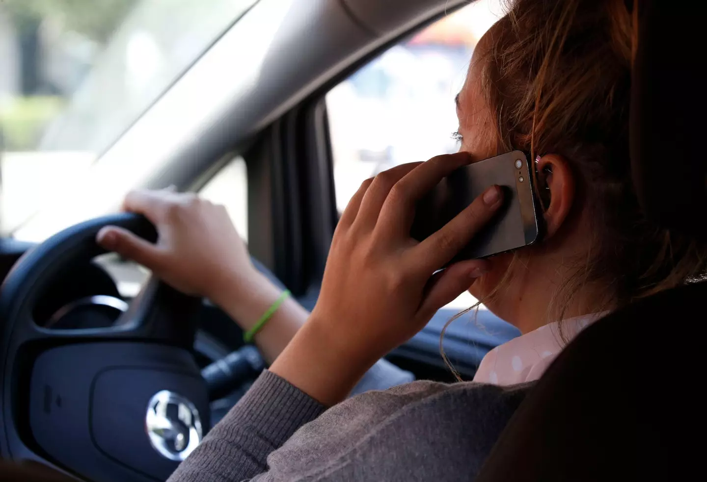 Driver on phone (Alamy)