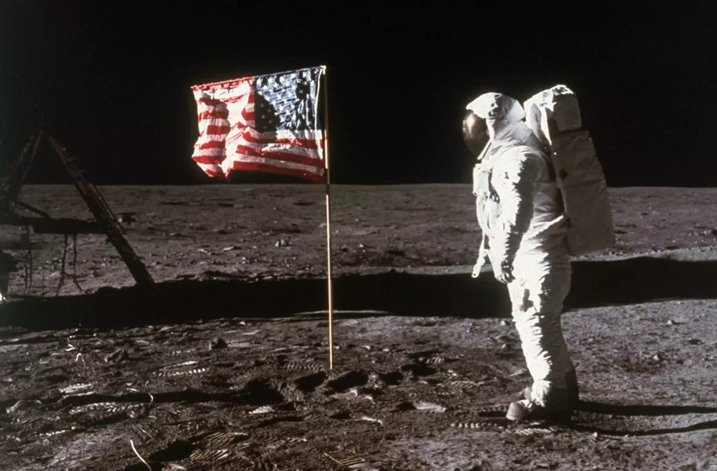 Buzz Aldrin stands beside the American flag as Neil Armstrong snaps the picture. (Bettmann/Getty)