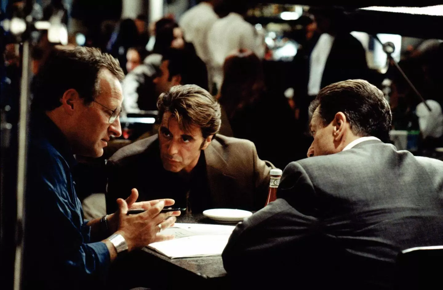 Director Michael Mann on set with Al Pacino and Robert De Niro.