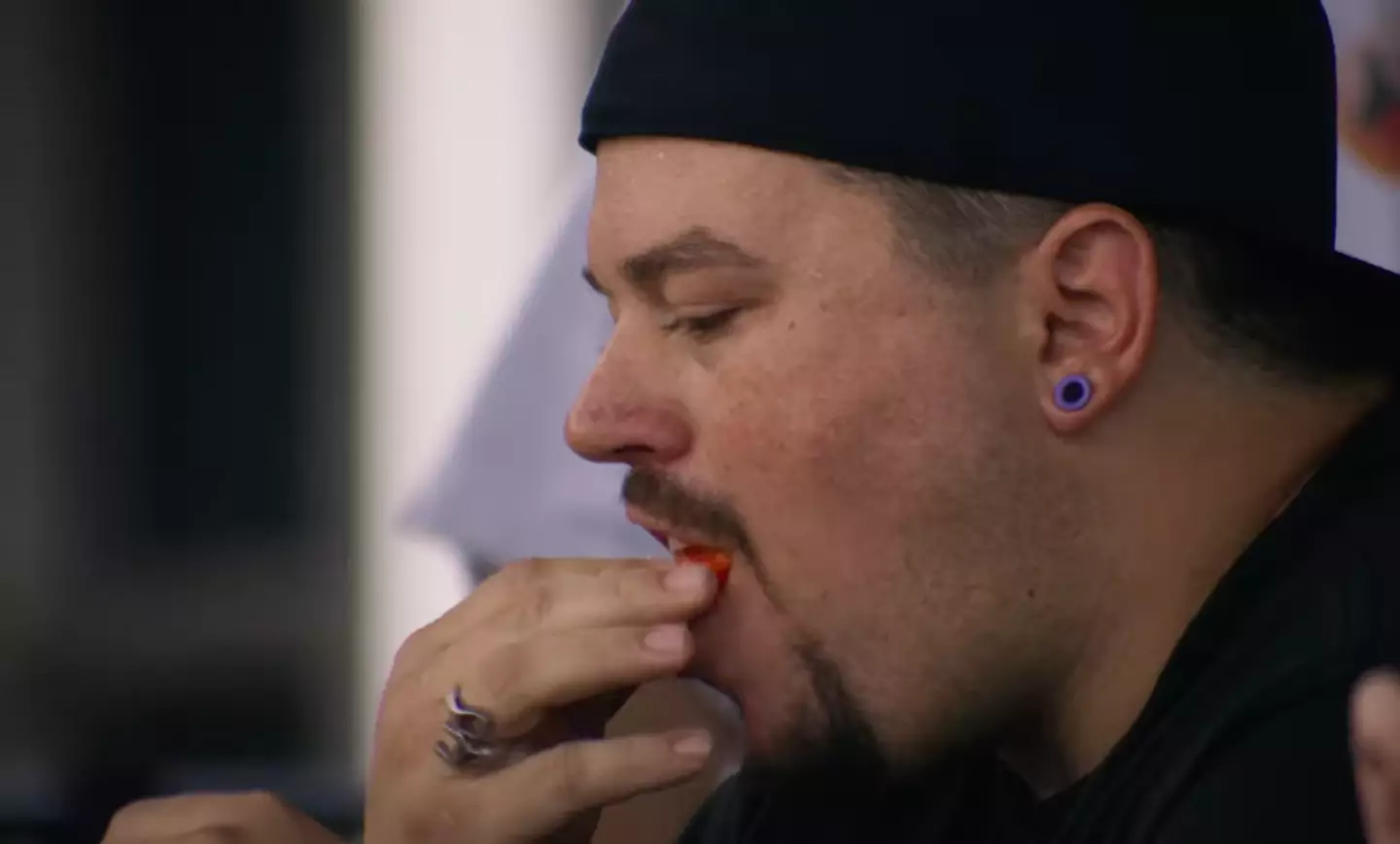 Dustin 'Atomik Menace' Johnson showed no emotion biting into the pepper.