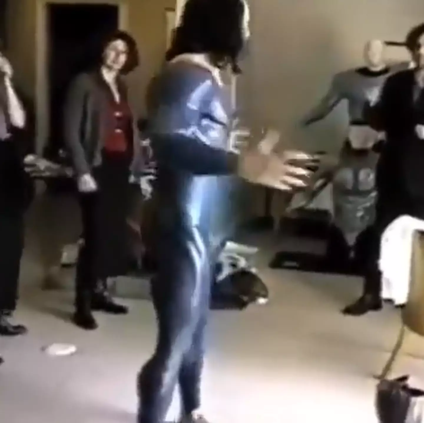 The clip sees Nicolas Cage trying on the Superman costume.
