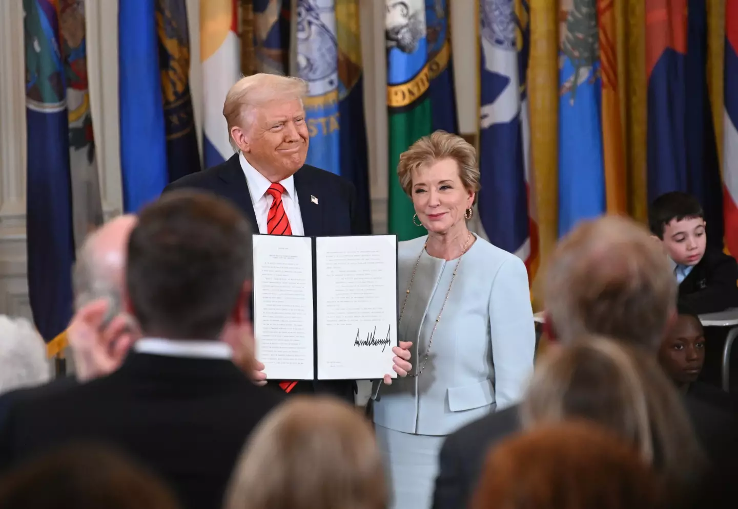 Trump pictured with U.S. Education Secretary Linda McMahon (Chen Mengtong/China News Service/VCG via Getty Images)
