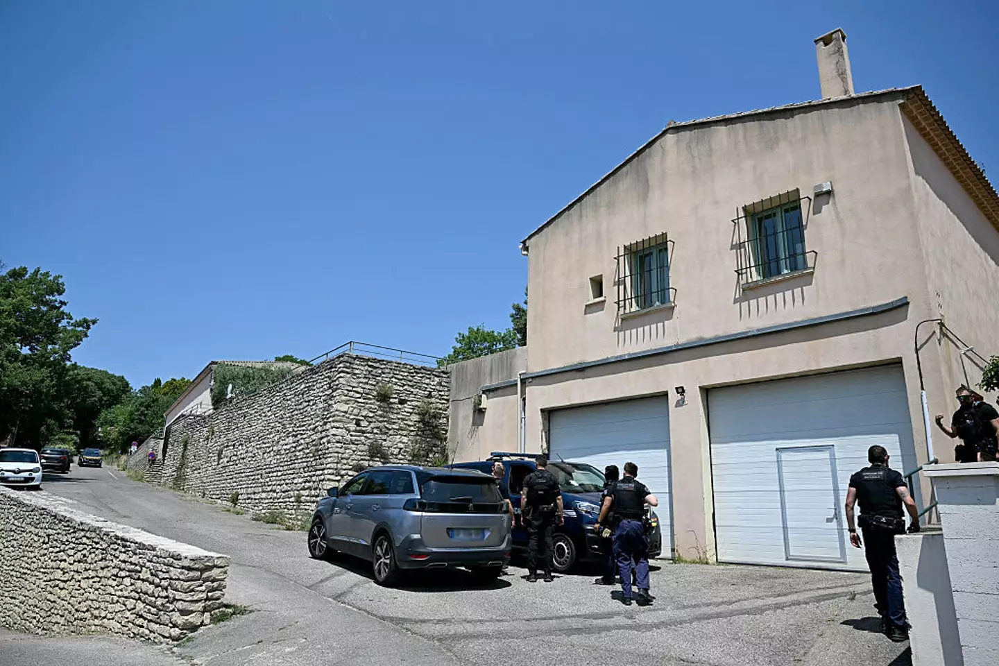 Police seen securing a perimeter near the site of the fatal shooting in France (GABRIEL BOUYS/AFP via Getty Images)