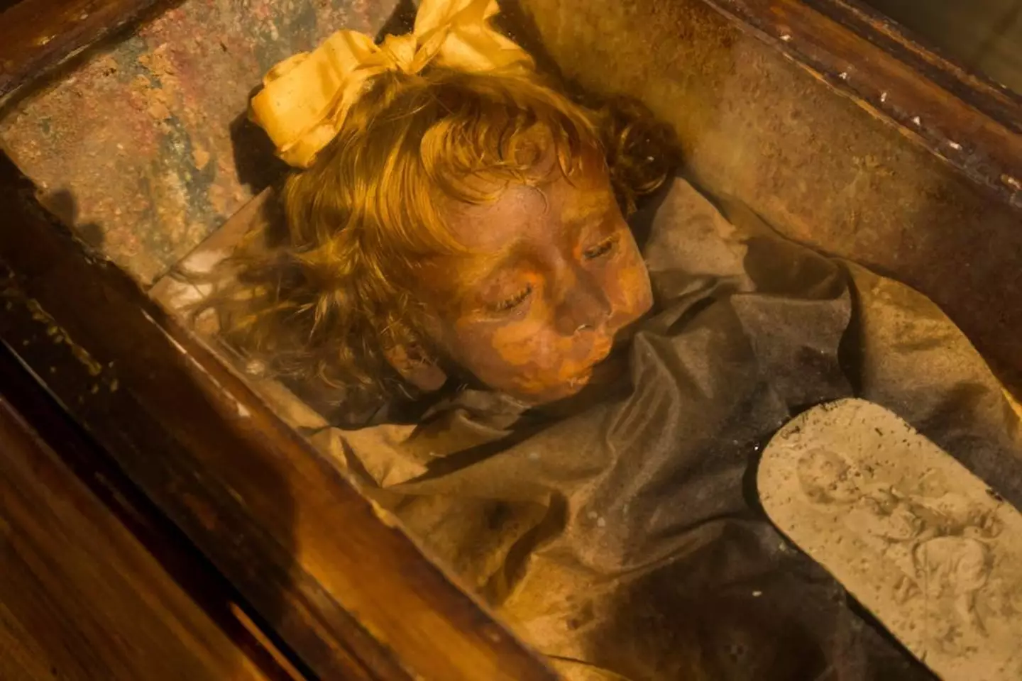 The toddler's body is so well preserved, some have accused it of being a wax replica.