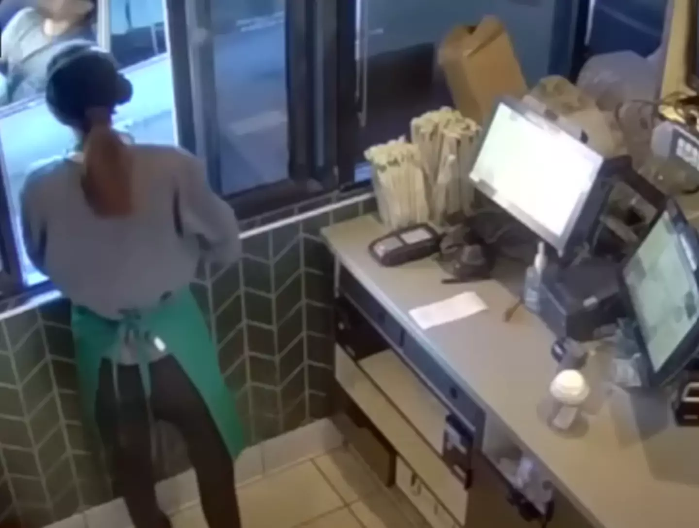 The security footage shows Garcia writhing in pain as the tea spills on him (KCAL News)