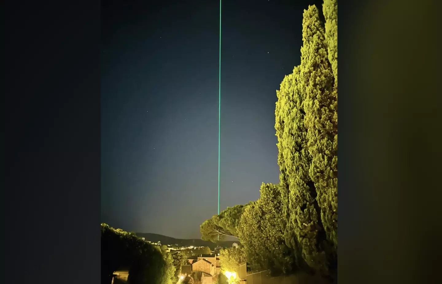 A Redditor shared a snap of a green laser they've been seeing frequently in the night sky. (Reddit/Apenerd)