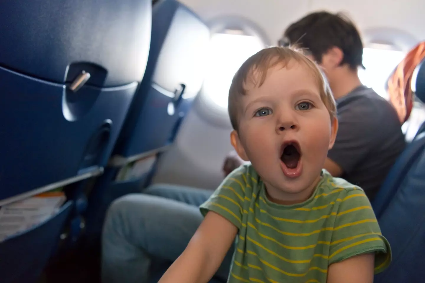 The 'audacity' of a mom to ask a stranger sitting next to her daughter if she could swap seats so that she could parent her child on a long flight. (Getty Stock Image)