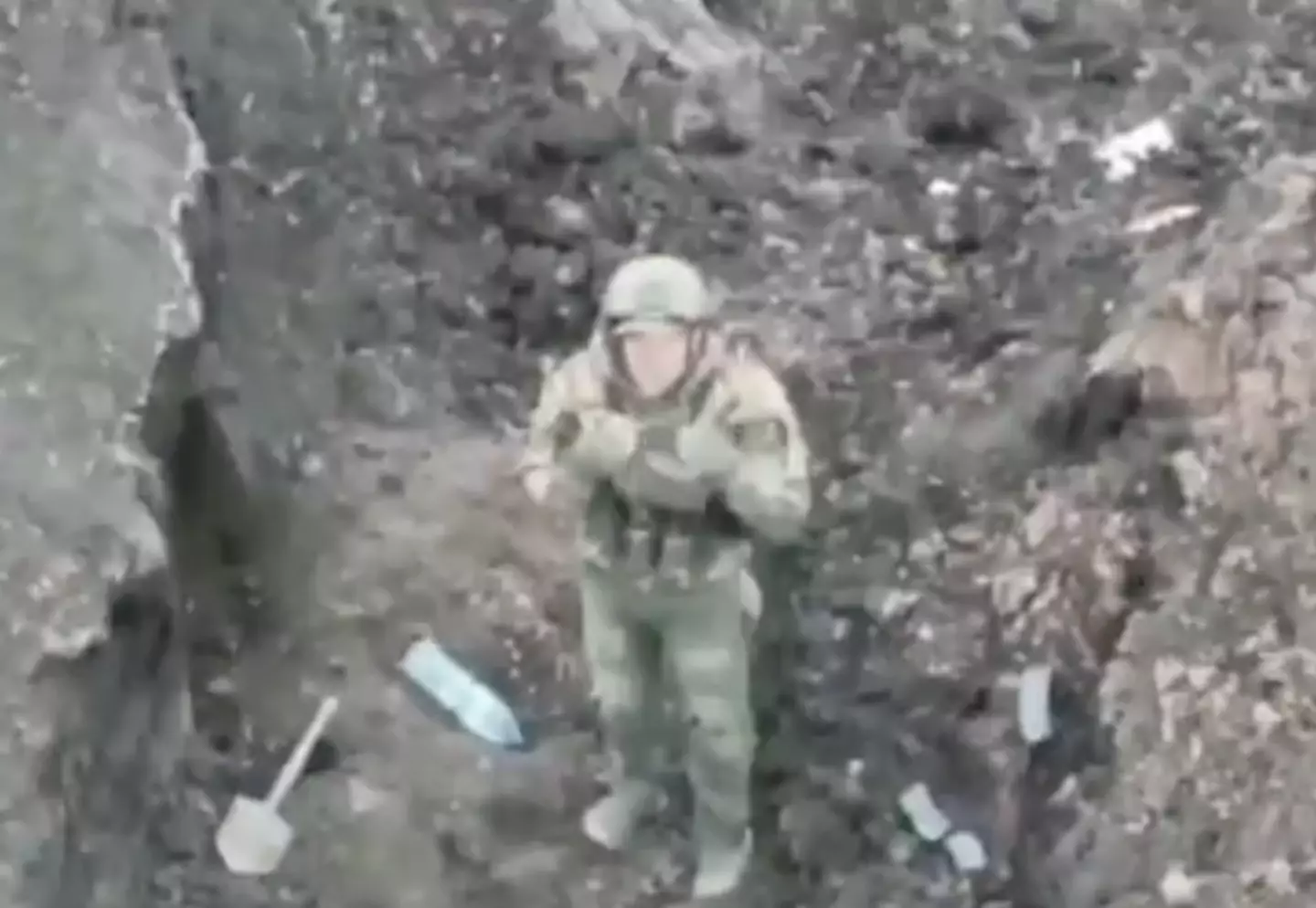 The soldier can be seen shaking his head at the drone.