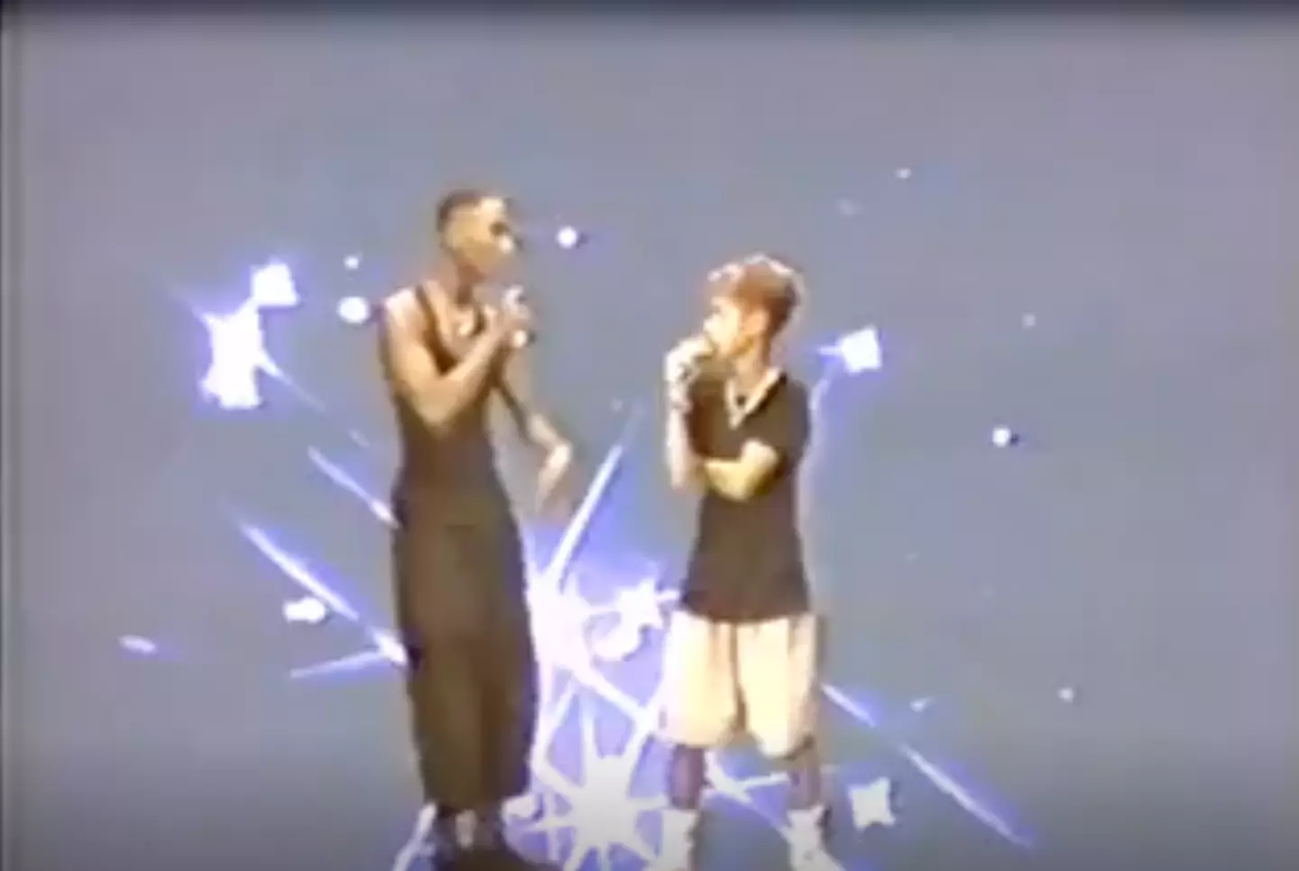 A young Tupac and Jada Pinkett Smith.