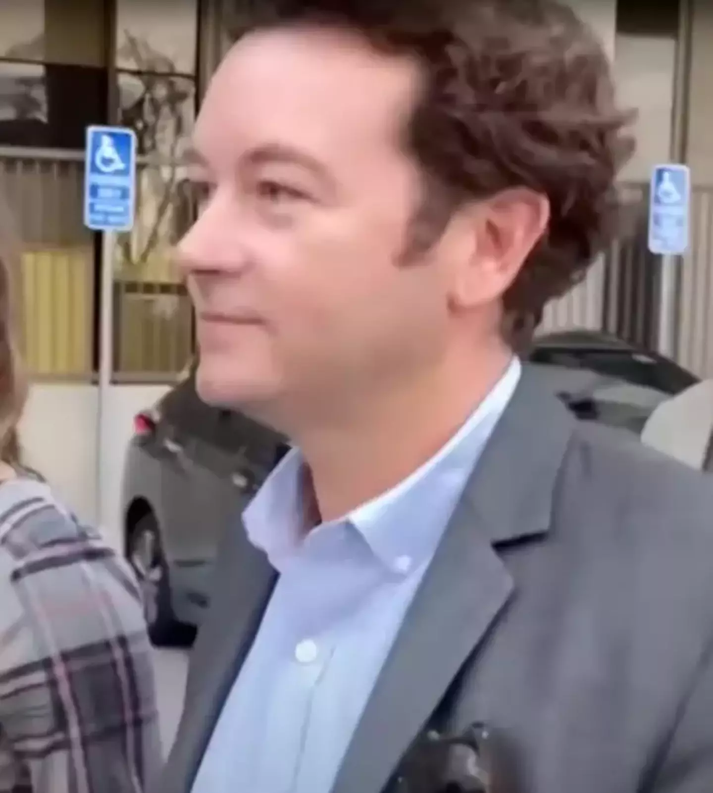 He was seen blowing a kiss to his wife before being taken away to prison.