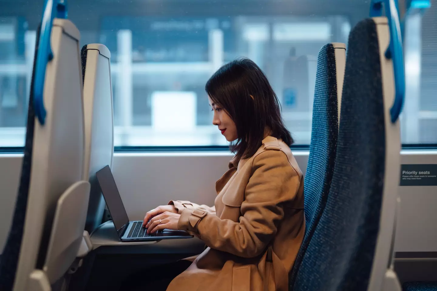 New search found that 66 percent of people who commute to work write emails on public transport (Getty Stock Image)
