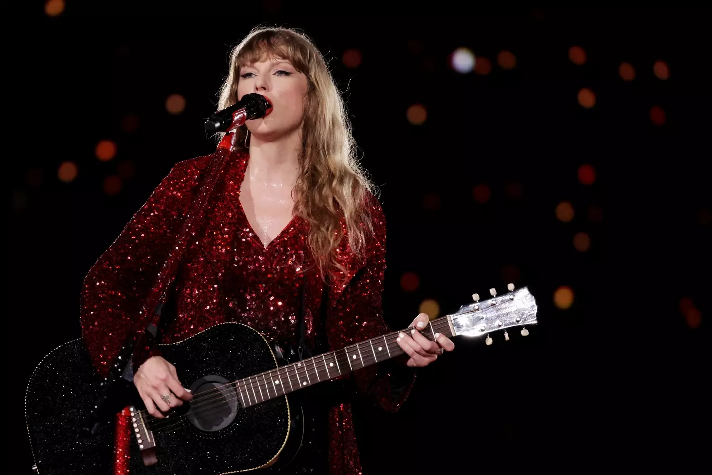 Taylor Swift singing at a show during the Eras Tour. (Ashok Kumar/TAS24/Getty Images for TAS Rights Management)