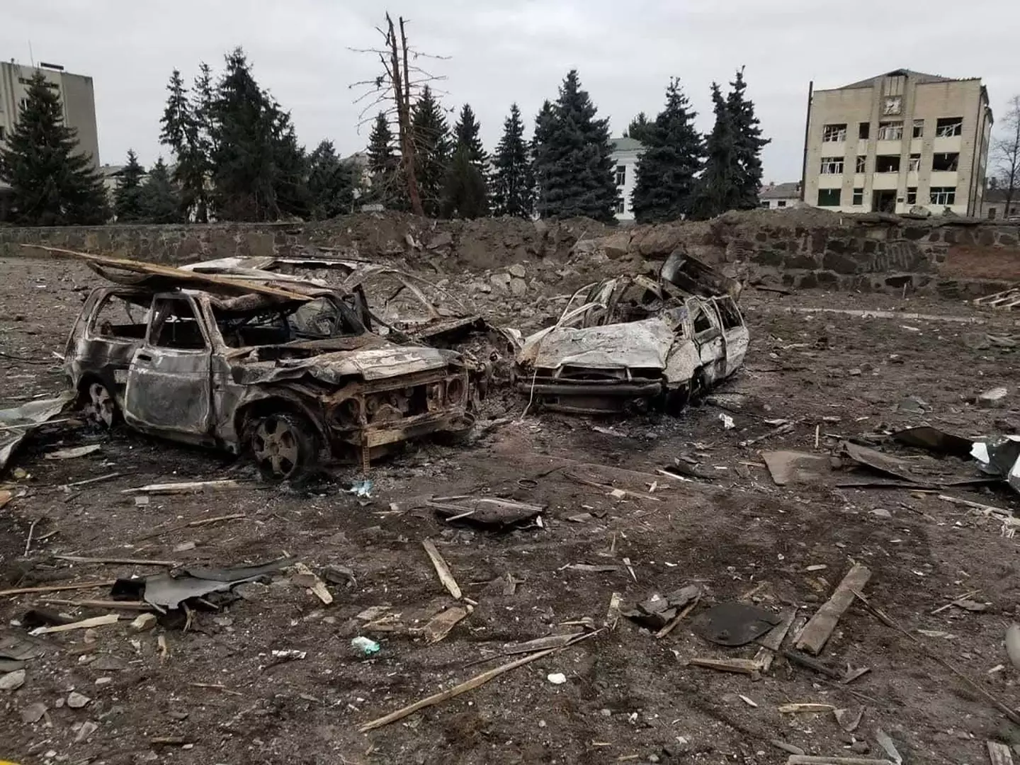 Remains of cars and residential buildings in Chernihiv.