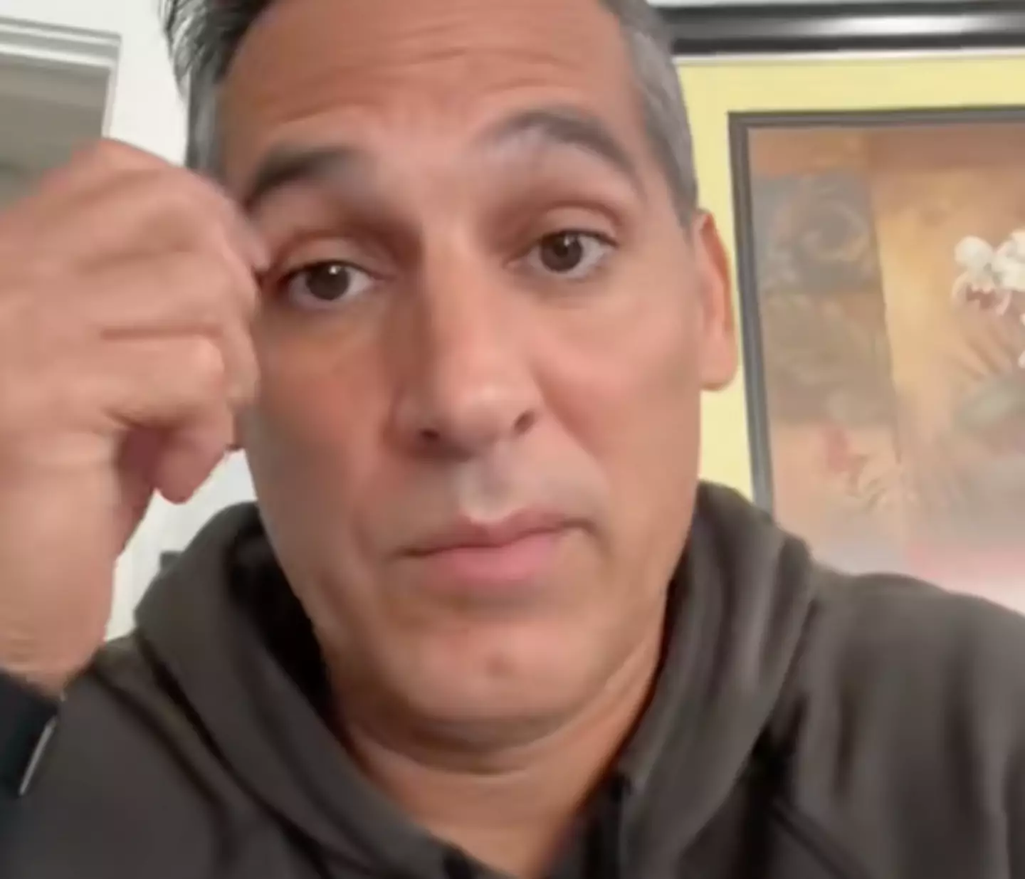 A man shared a video to TikTok accusing a fellow plane passenger of 'stealing' his Apple phone charger (TikTok/ @rcrelated1)