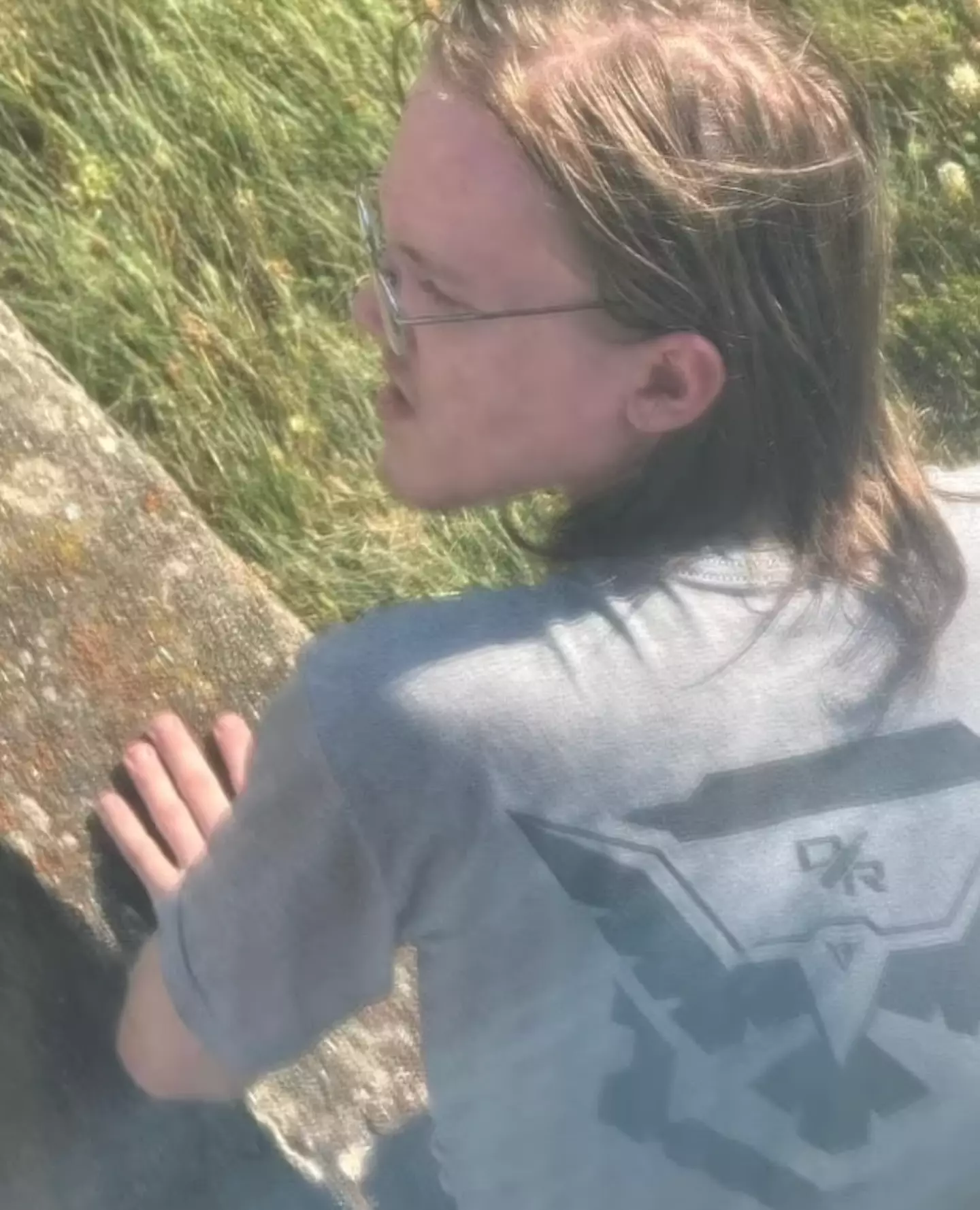 The 20-year-old seemed to look round at someone. (Judicial Watch)