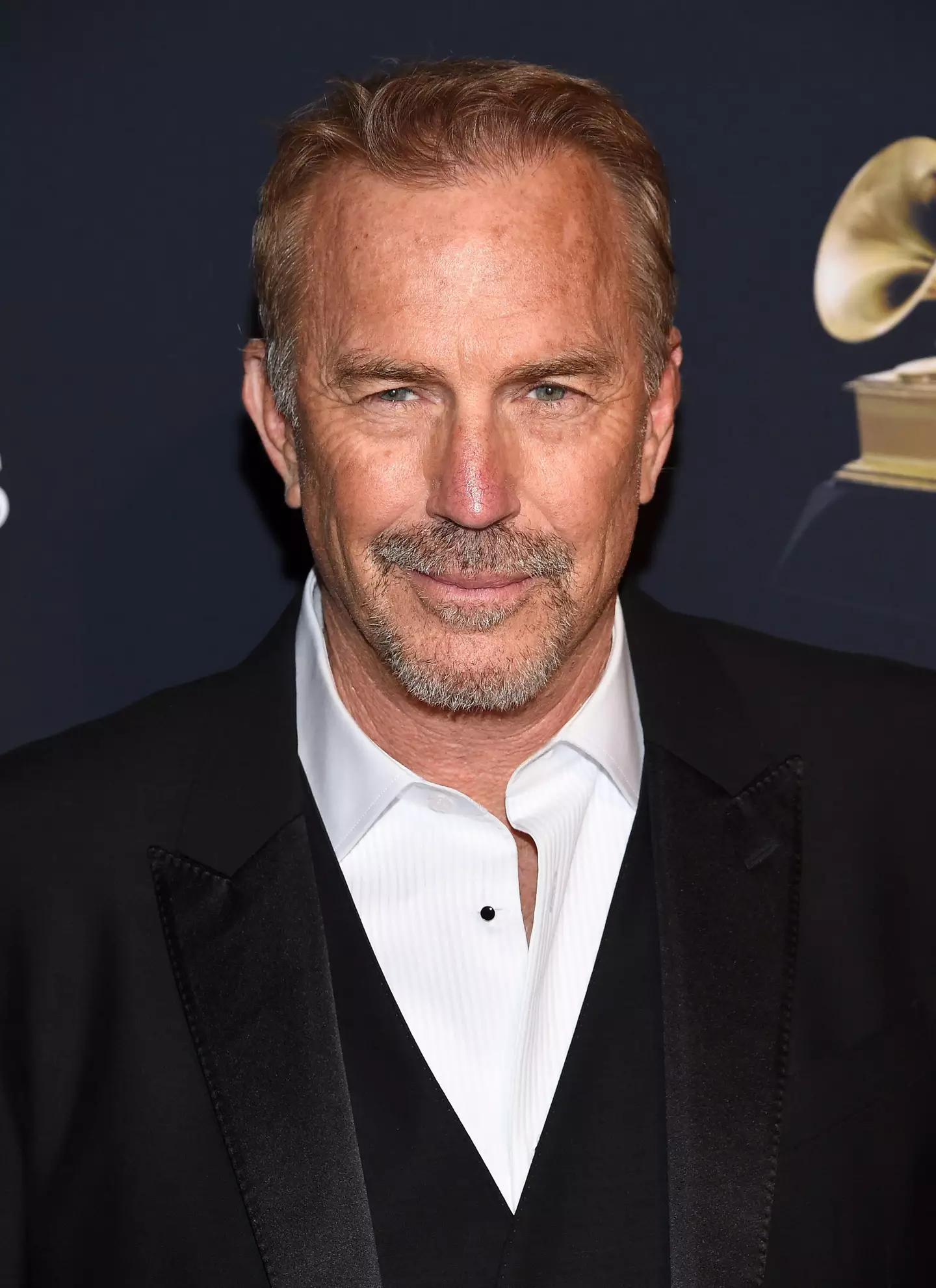 Kevin Costner wants his estranged wife to vacate their home.