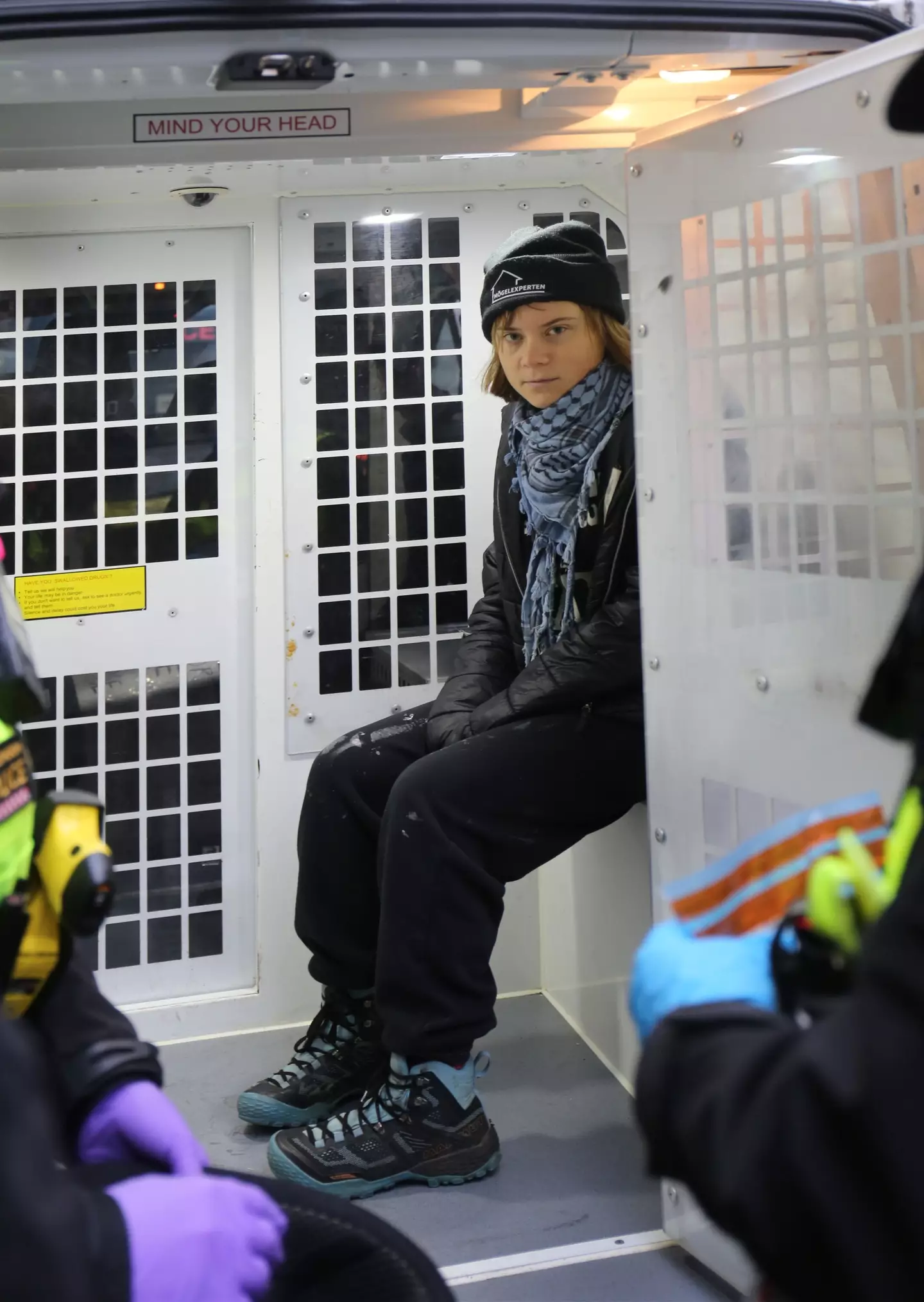 Thunberg pictured in the back of a UK police car (PA/Prisoners for Palestine)