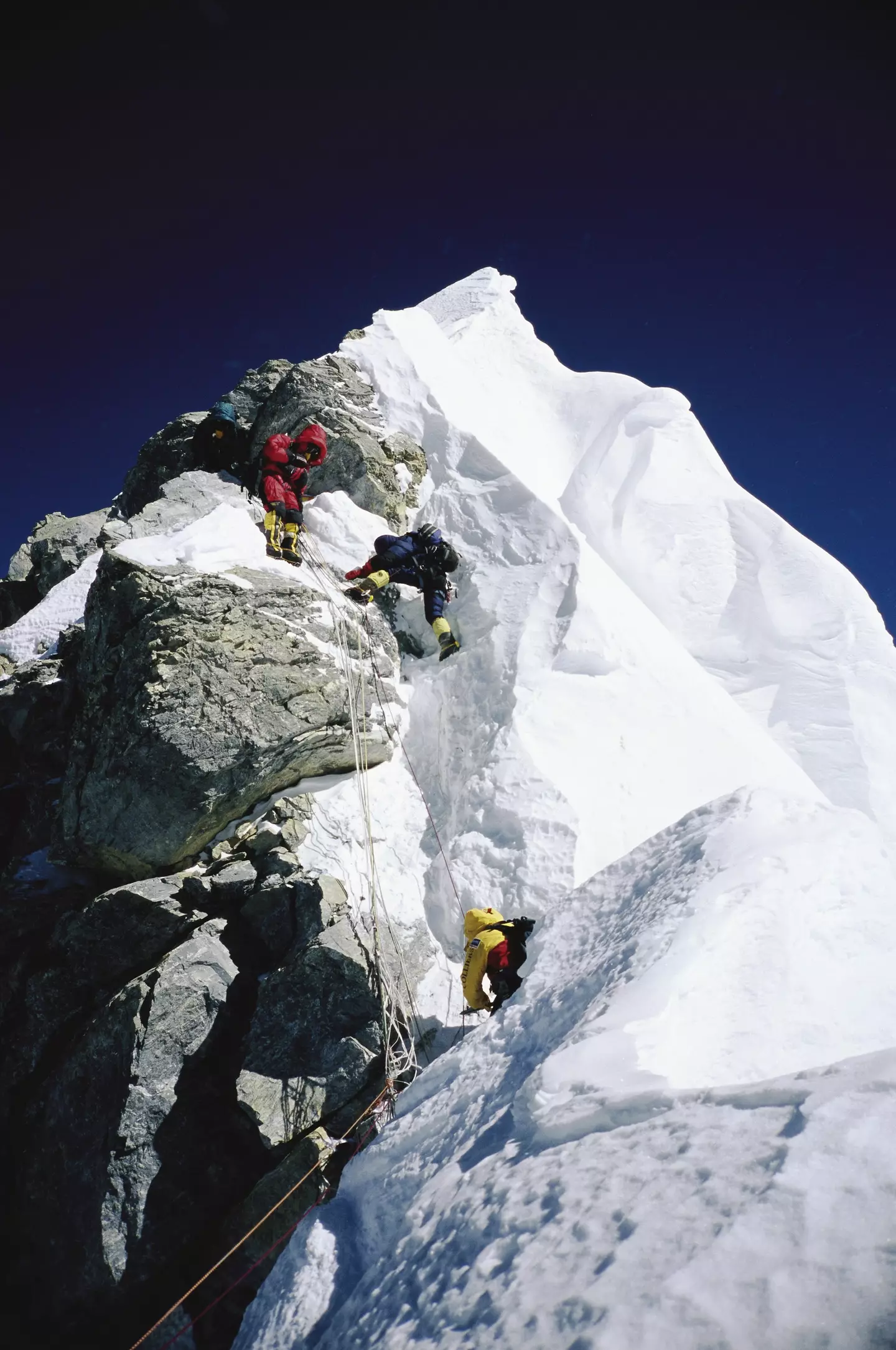 Mountaineers navigating through the Hillary Step on Mount Everest.