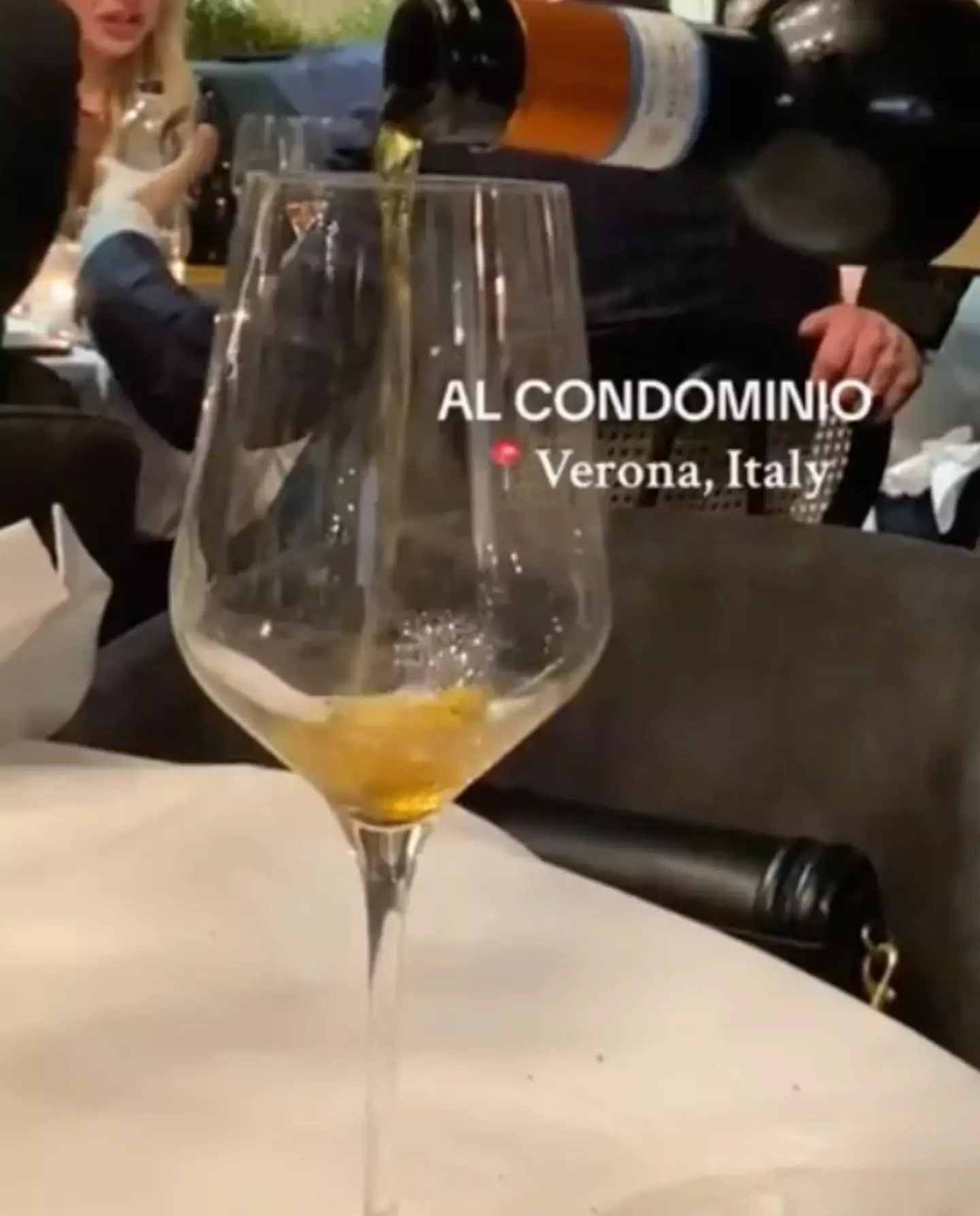 You can get a free bottle of wine if you hand over your phone. (TikTok/@leca.ursachi)