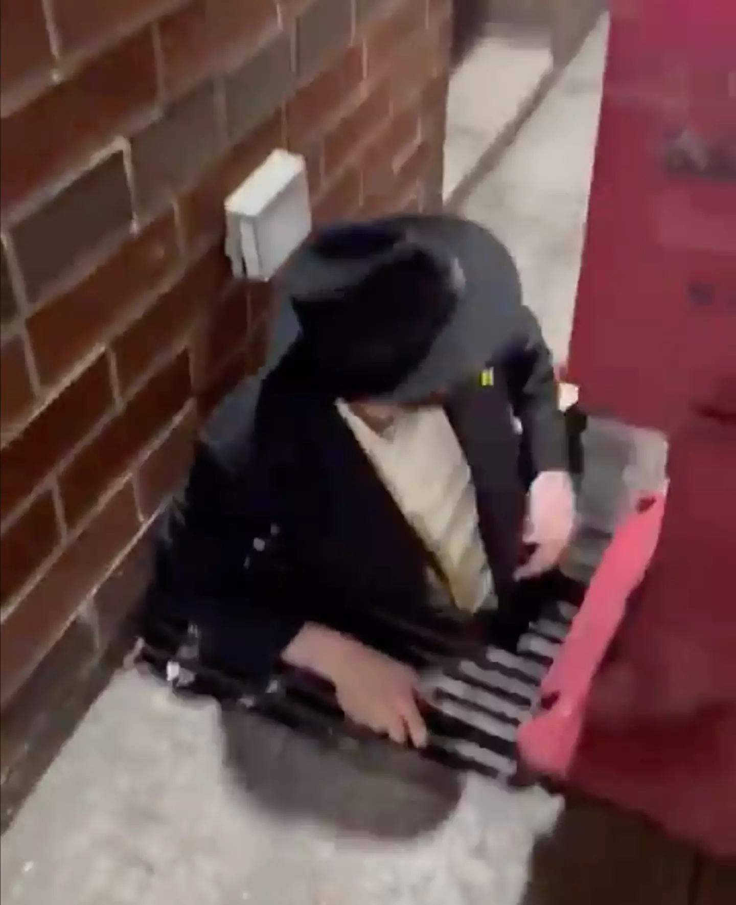 A man was seen exiting an underground tunnel.