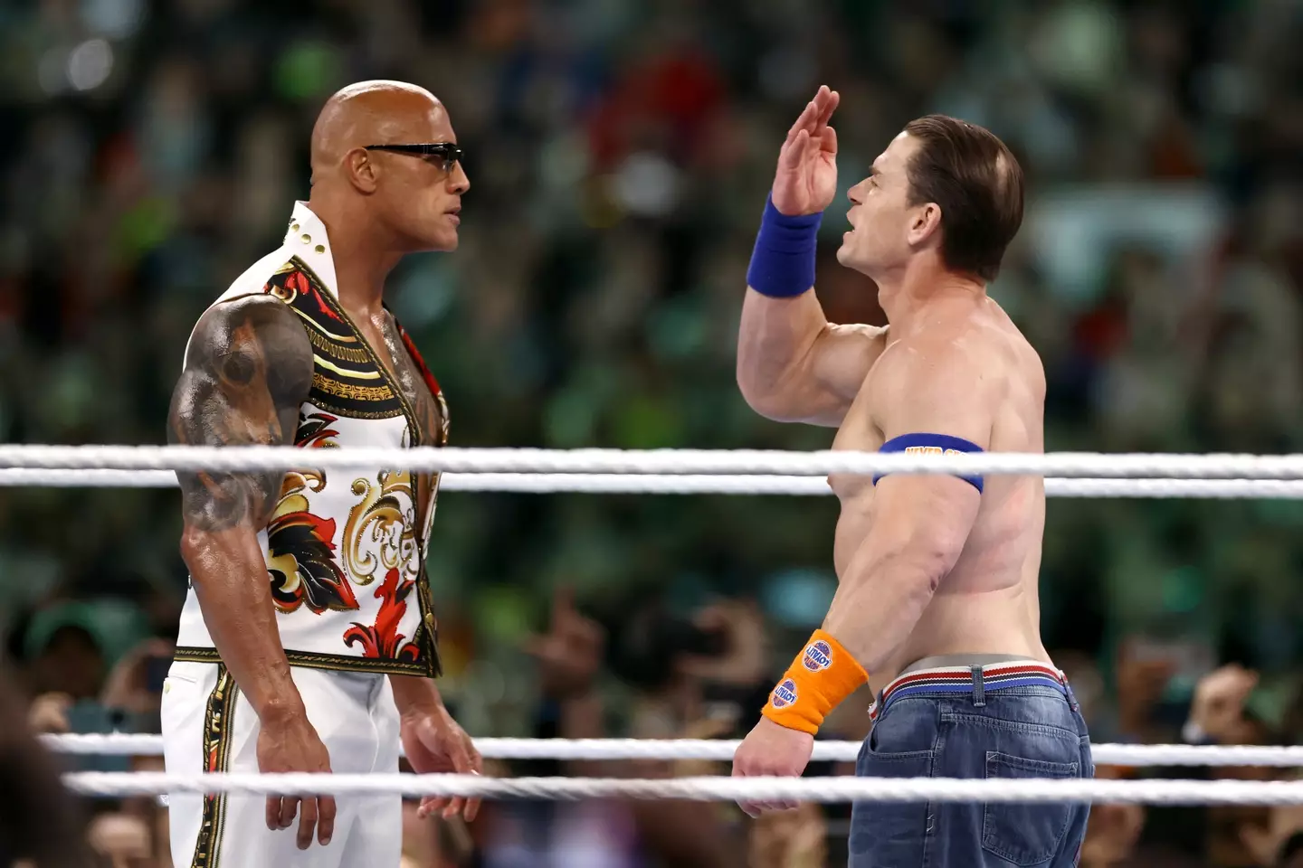 The Rock squares off against John Cena. Tim Nwachukwu/Getty Images