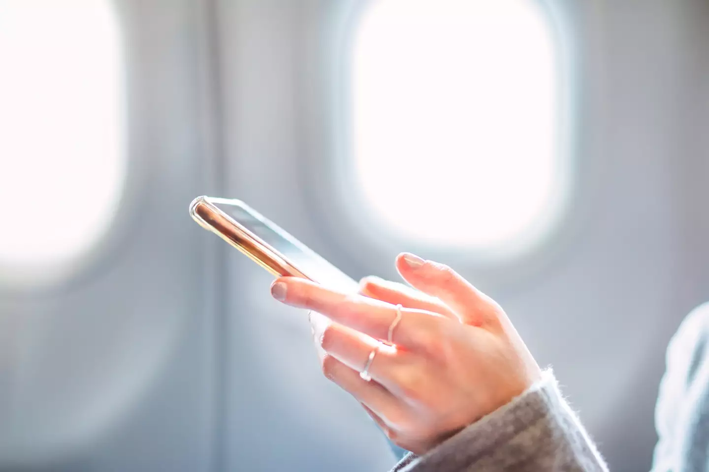 If your phone falls down the side of the seat, you have to tell cabin crew immediately (Getty Stock Image)