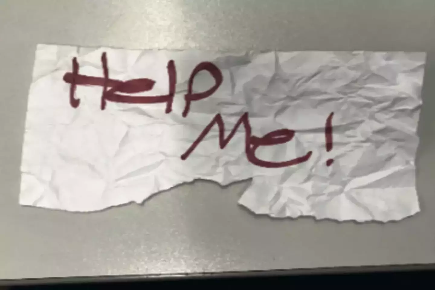 The note written by the 13-year-old girl which led to her rescue outside a laundromat in Long Beach (US Department of Justice)