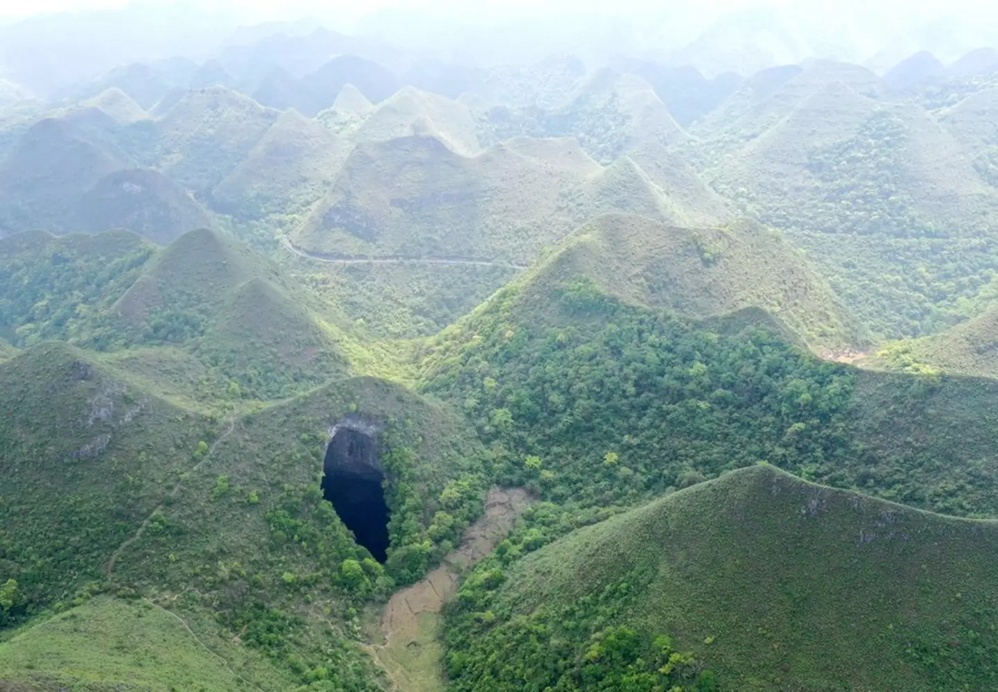A giant karst sinkhole at Leye-Fengshan Global Geopark.